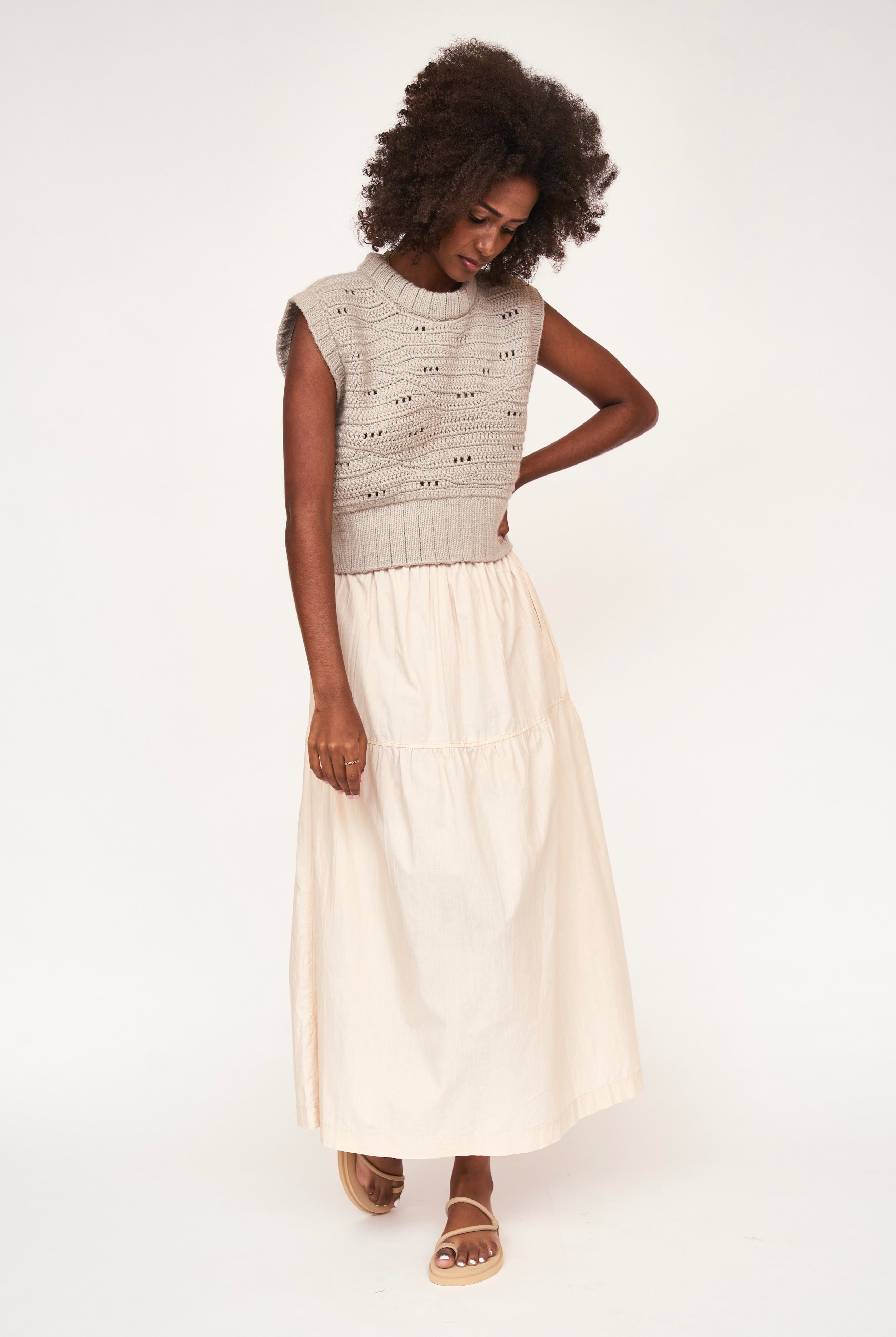 Girl wearing MIRTH women's elastic waist tiered brighton long skirt in parchment cream cotton poplin