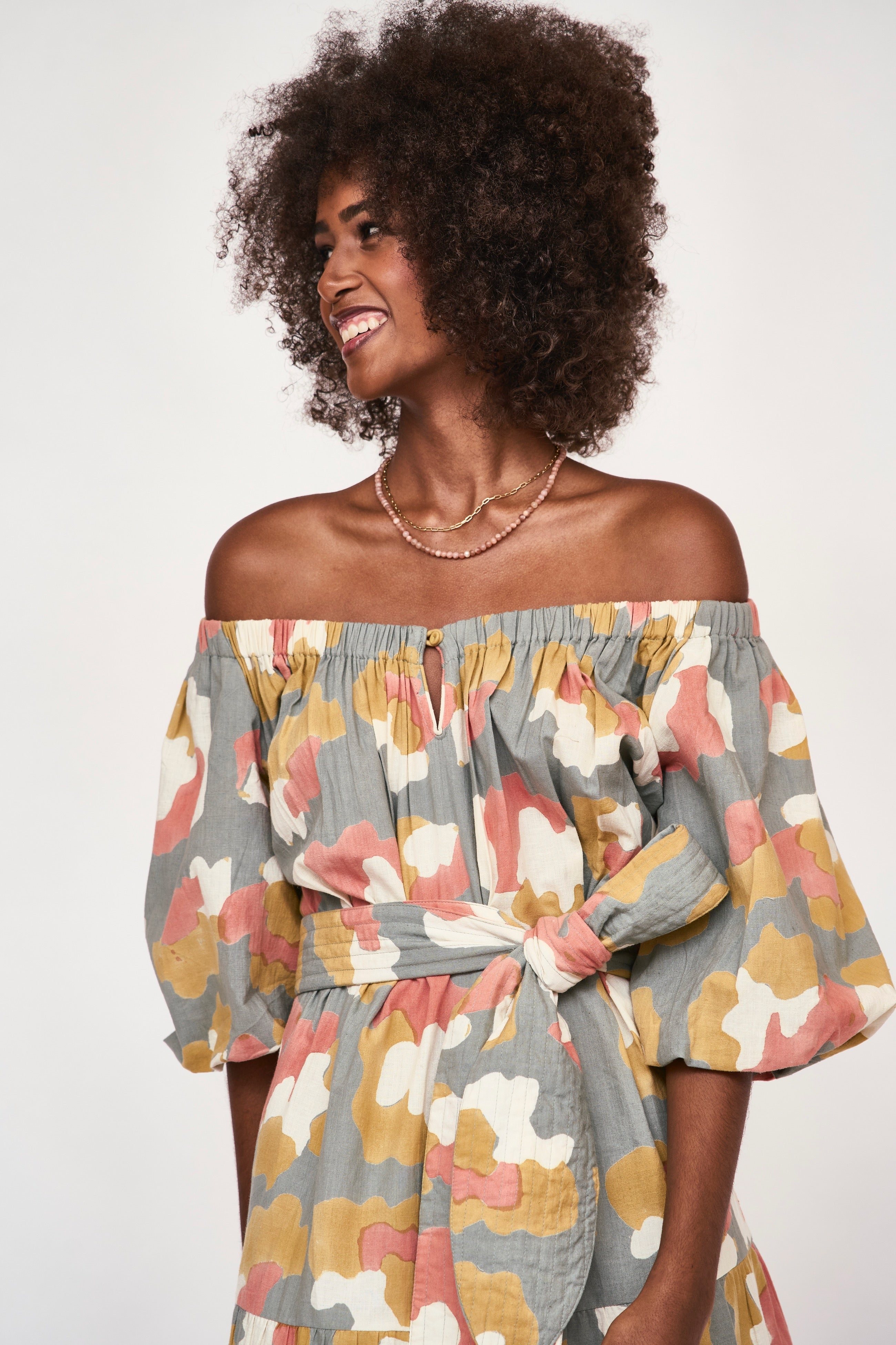 Girl wearing MIRTH women's long tiered short sleeve capri maxi dress in waterlily grey floral cotton