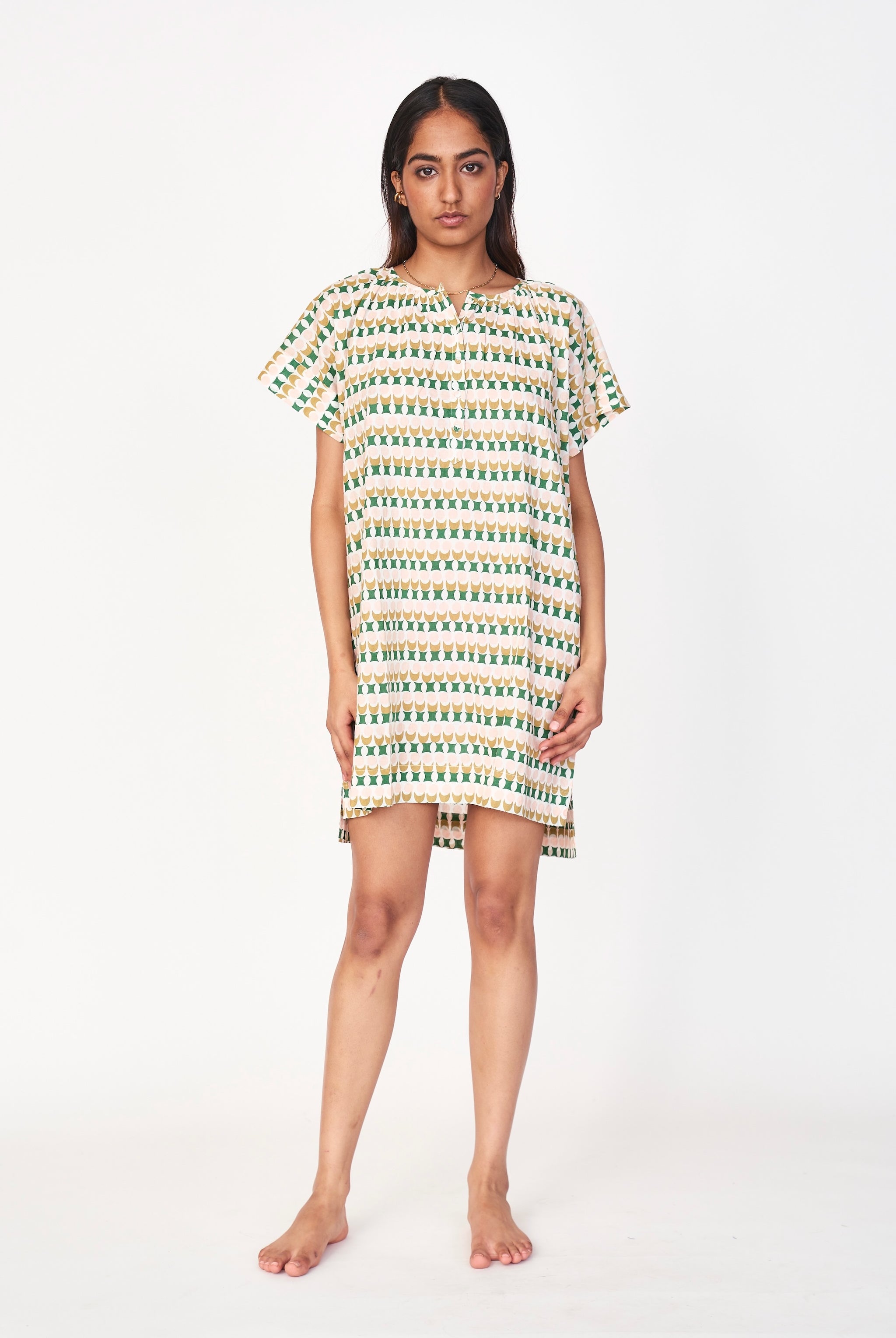 Girl wearing MIRTH women's short nightgown dress in jawbreaker green cotton