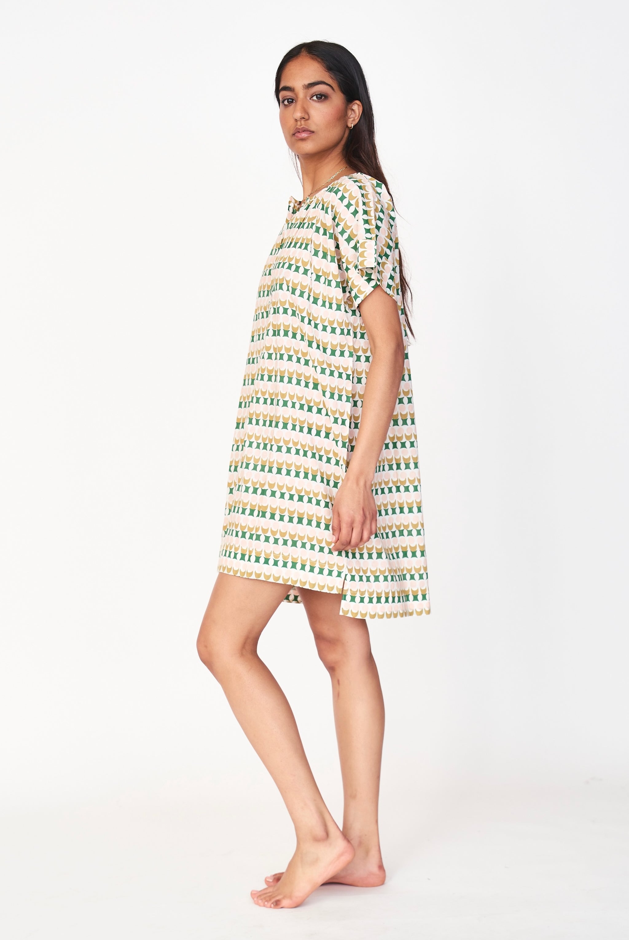 Girl wearing MIRTH women's short nightgown dress in jawbreaker green cotton