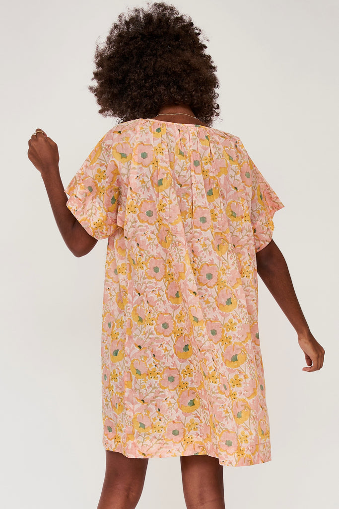 Girl wearing MIRTH women's short nightgown dress in pink lemonade cotton