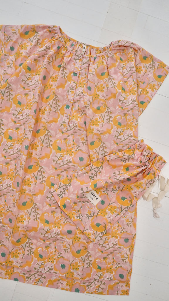 Girl wearing MIRTH women's short nightgown dress in pink lemonade cotton