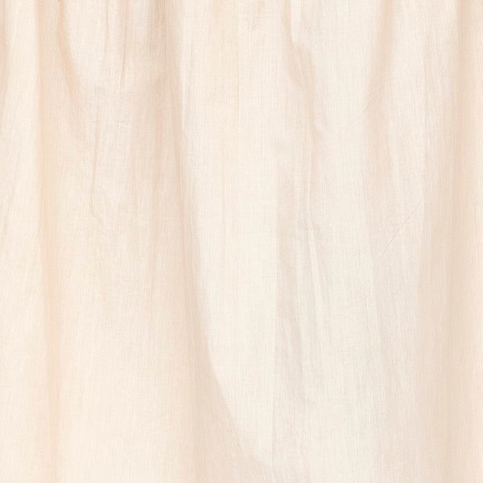 Girl wearing MIRTH women's elastic waist tiered brighton long skirt in parchment cream cotton poplin