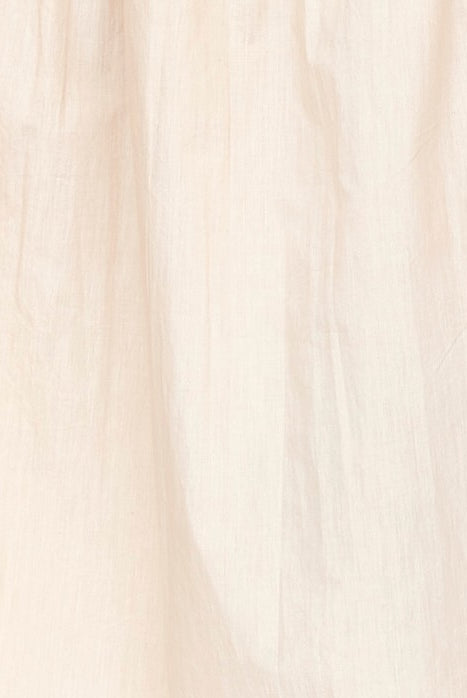 Girl wearing MIRTH women's v neck ruched collar three quarter sleeve palm springs top in parchment beige cotton poplin