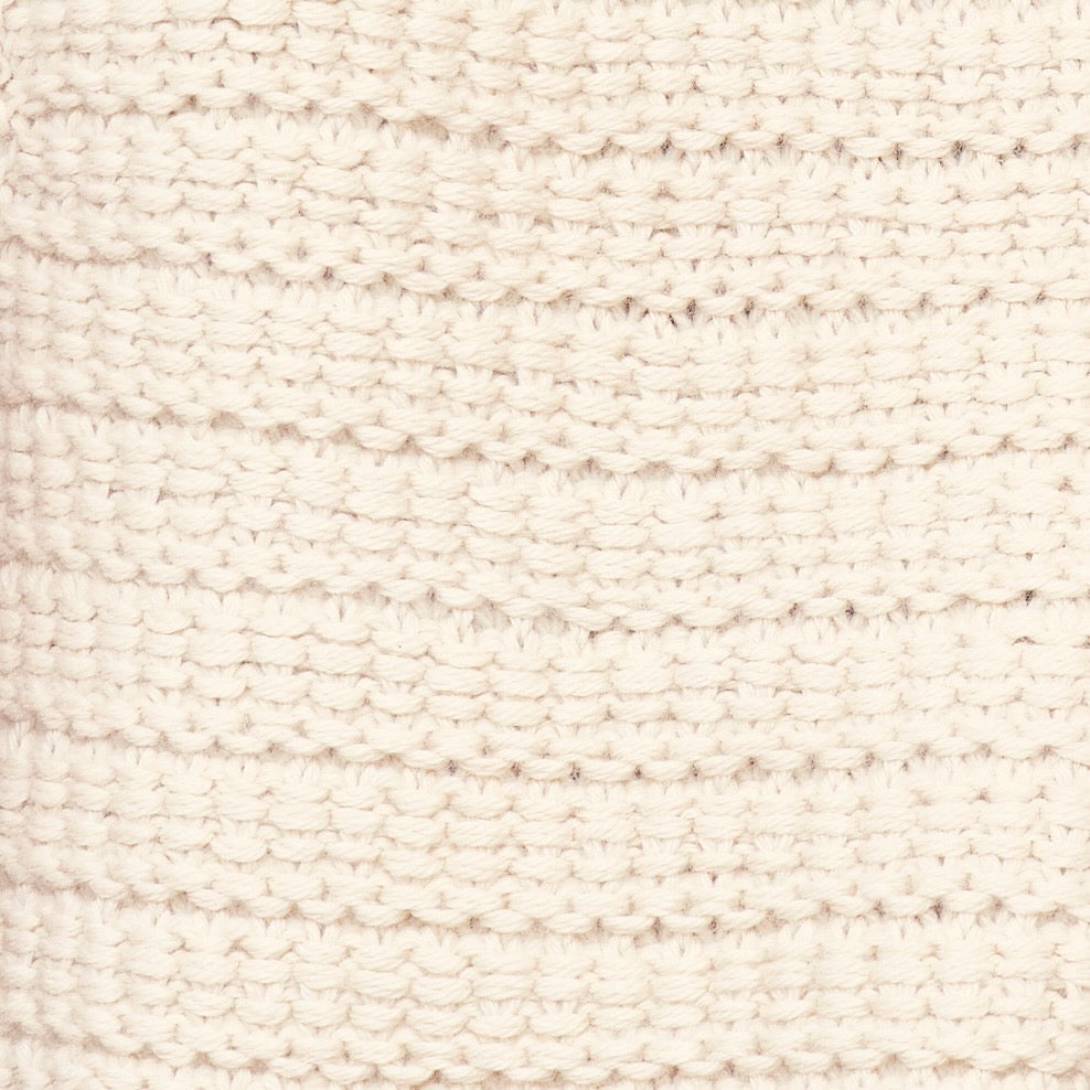 Girl wearing MIRTH women's sleeveless carmel open side knit sweater vest in snow white alpaca wool