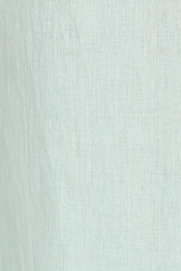 Girl wearing MIRTH women's smocked elastic sleeveless georgia midi dress in frost blue cotton