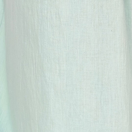 Girl wearing MIRTH women's smocked elastic sleeveless georgia midi dress in frost blue cotton