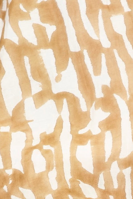 Girl wearing MIRTH women's ballon sleeve andaman cropped top in brown driftwood cotton silk