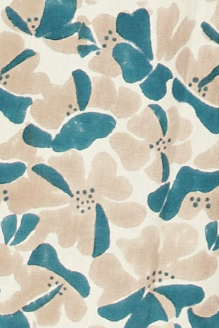 Girl wearing MIRTH women's wide leg elastic track shorts in plumeria blue floral print cotton