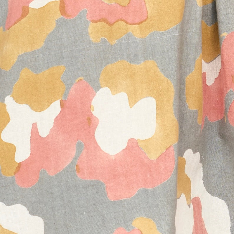 Girl wearing MIRTH women's long tiered short sleeve capri maxi dress in waterlily grey floral cotton