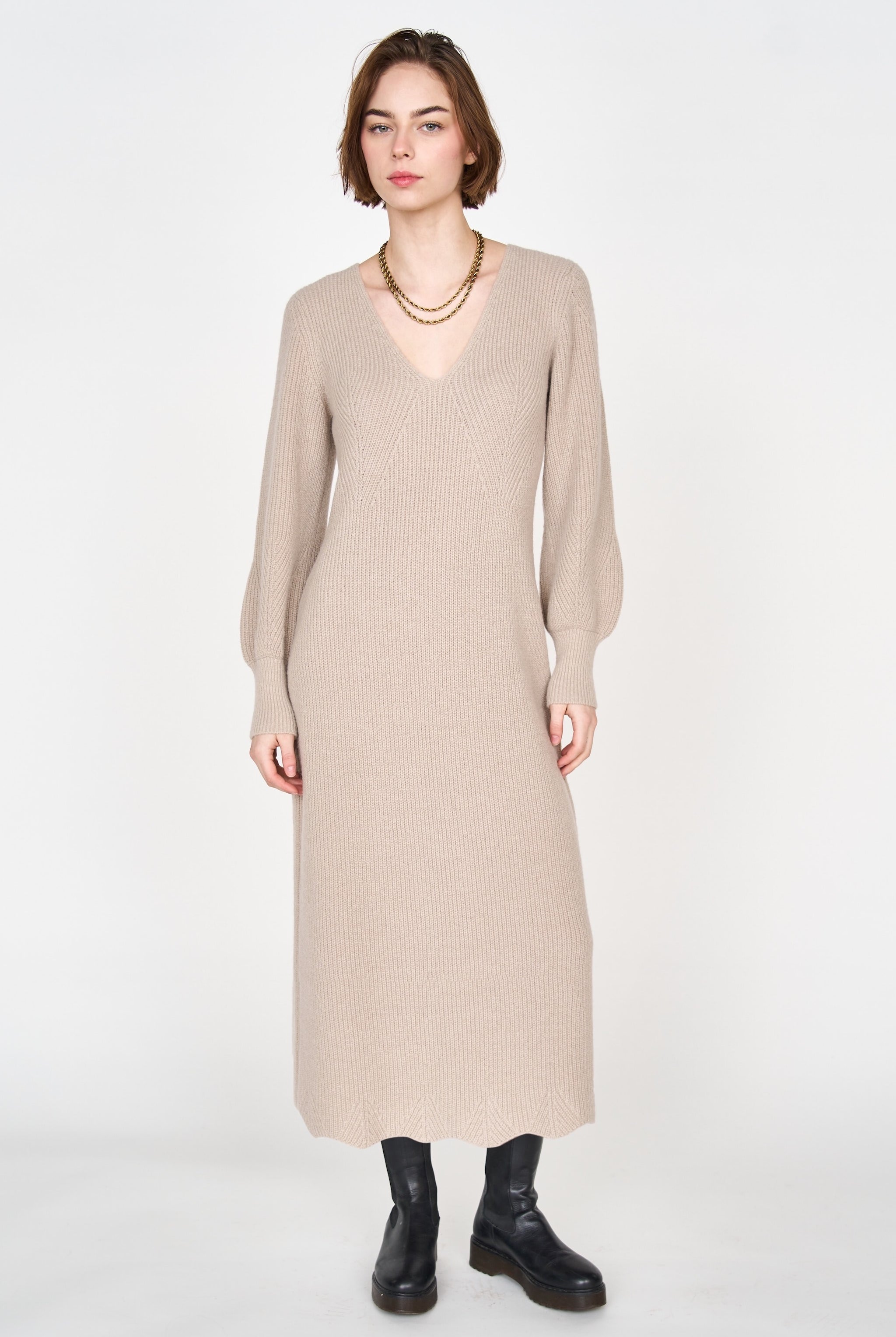 Girl wearing MIRTH women's knit v neck bellagio sweater dress in taupe brown wool