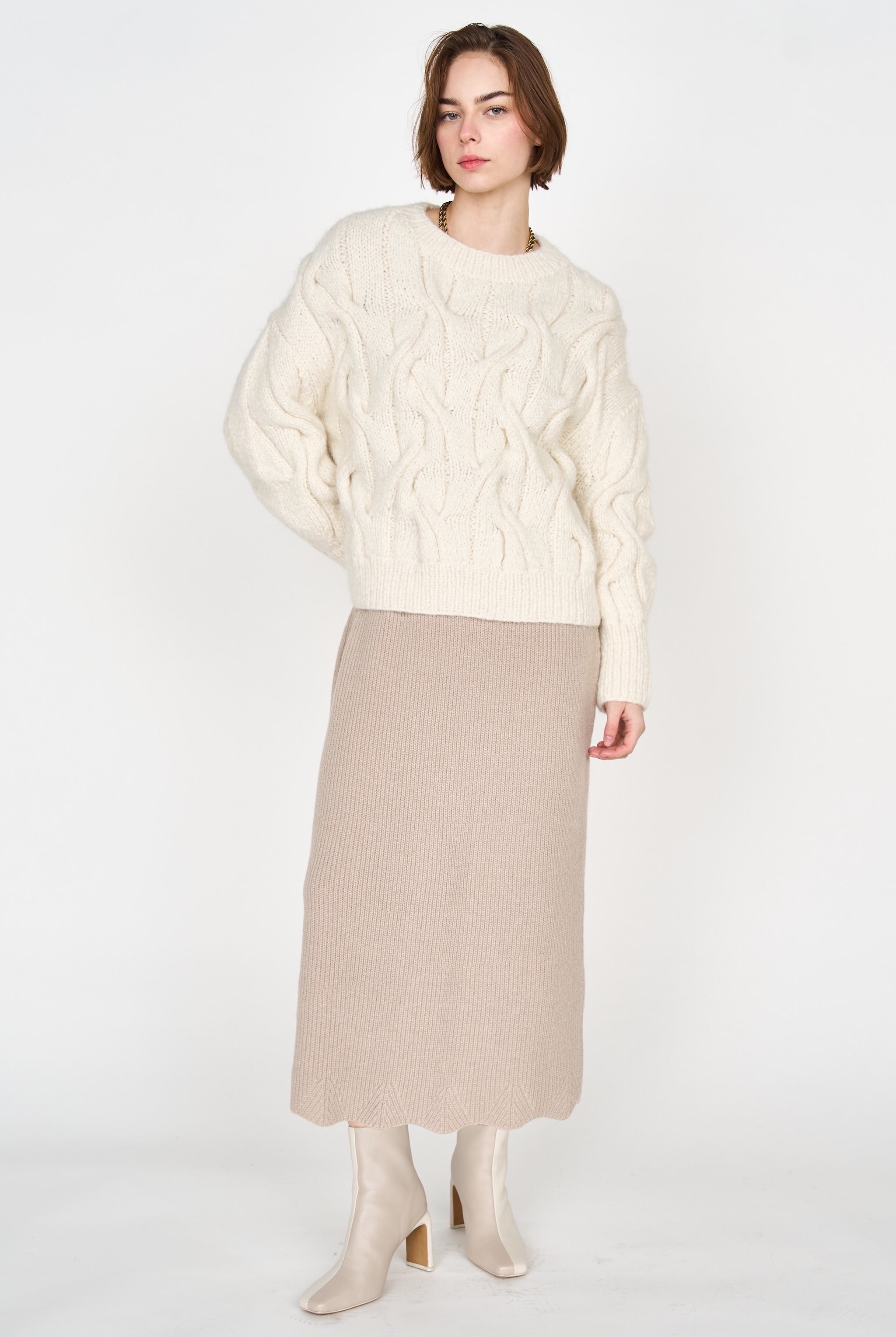 Girl wearing MIRTH women's knit v neck bellagio sweater dress in taupe brown wool