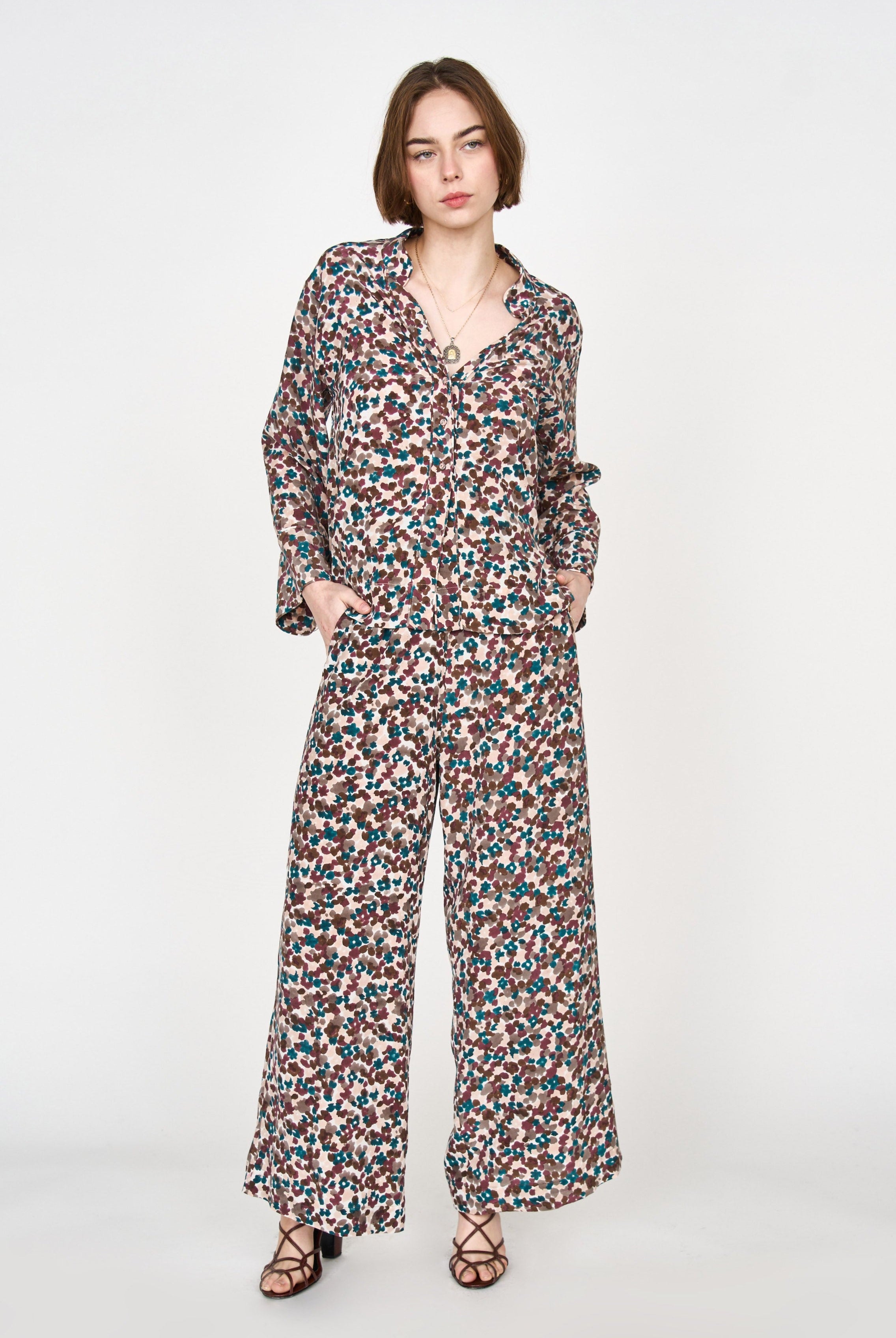 Girl wearing MIRTH women's button down collared long sleeve malmo shirt in purple brown amaryllis silk