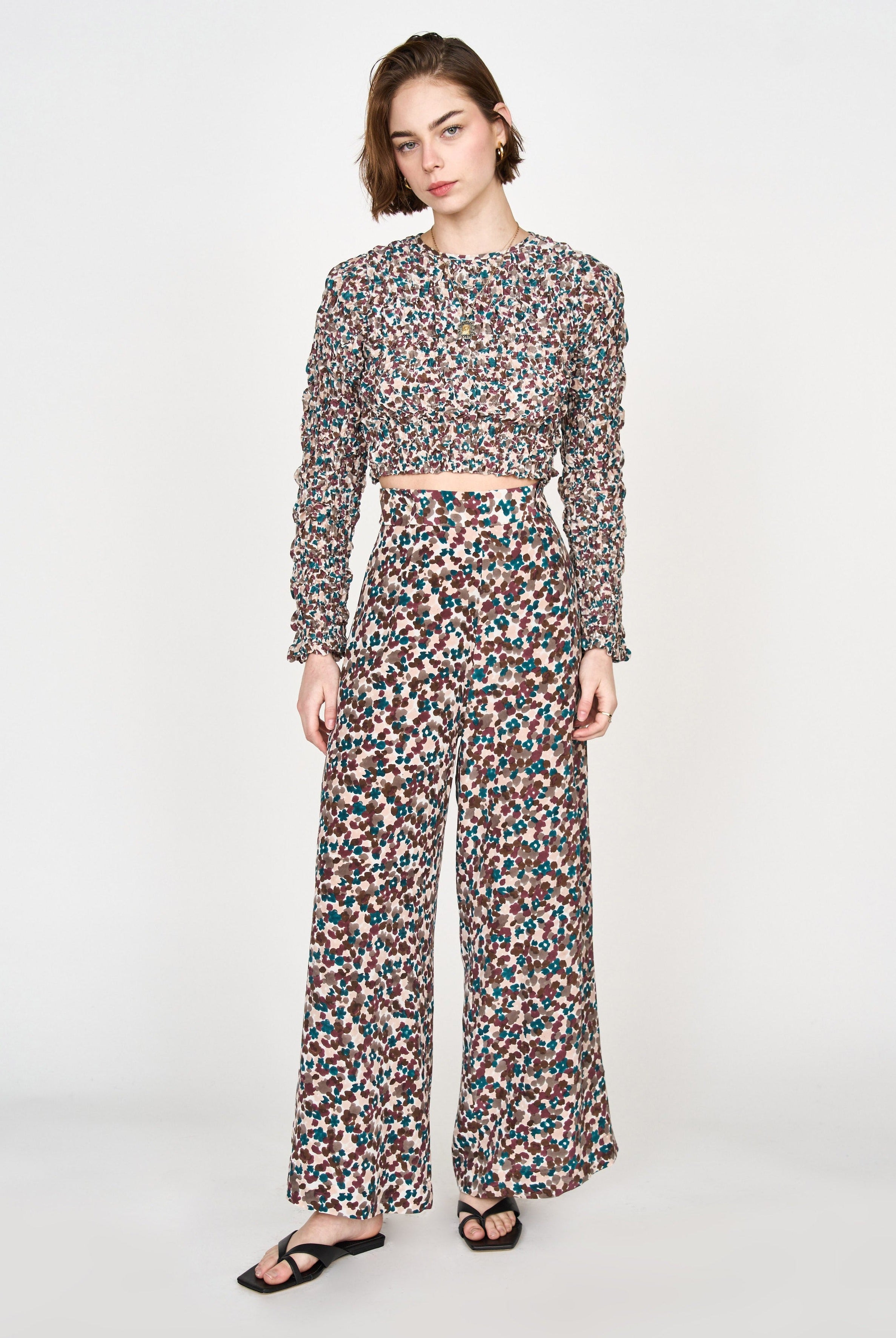 Girl wearing MIRTH women's long flowy riga trouser pant in purple brown amaryllis silk