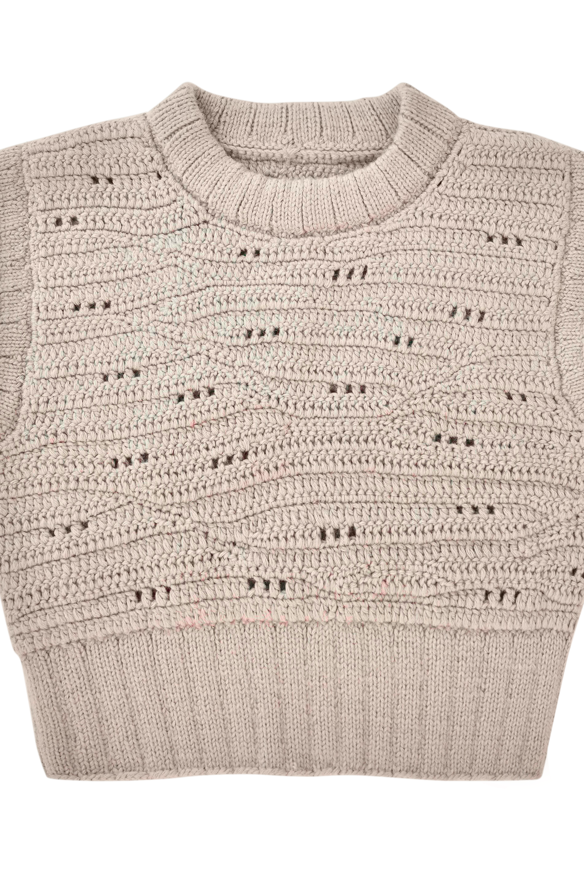 Girl wearing MIRTH women's hand crocheted marin sweater vest in koala grey alpaca wool
