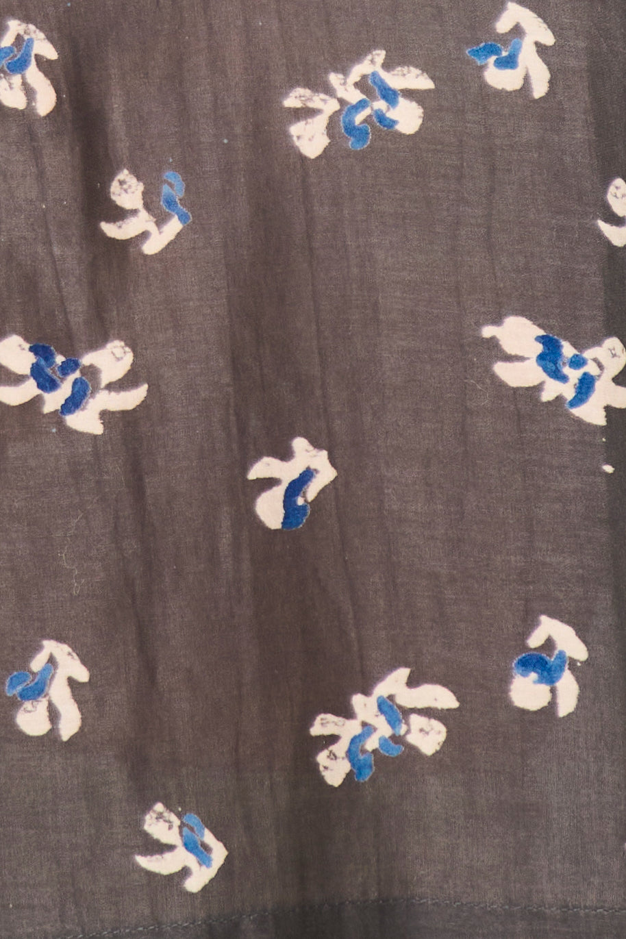 Dark fabric with white and blue floral patterns