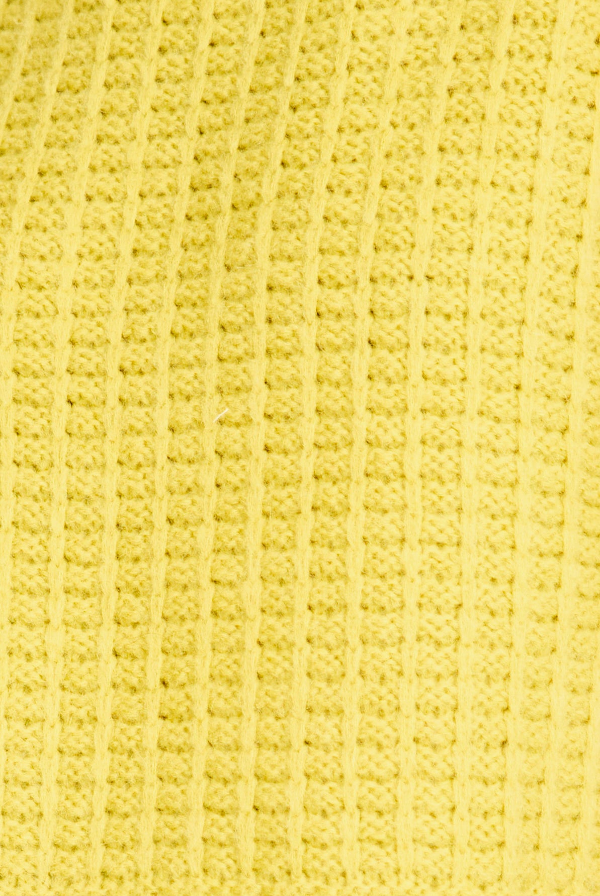 Close-up of a textured yellow fabric