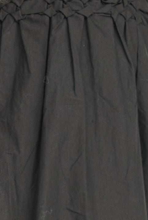 Close-up of a dark gray fabric with pleated texture