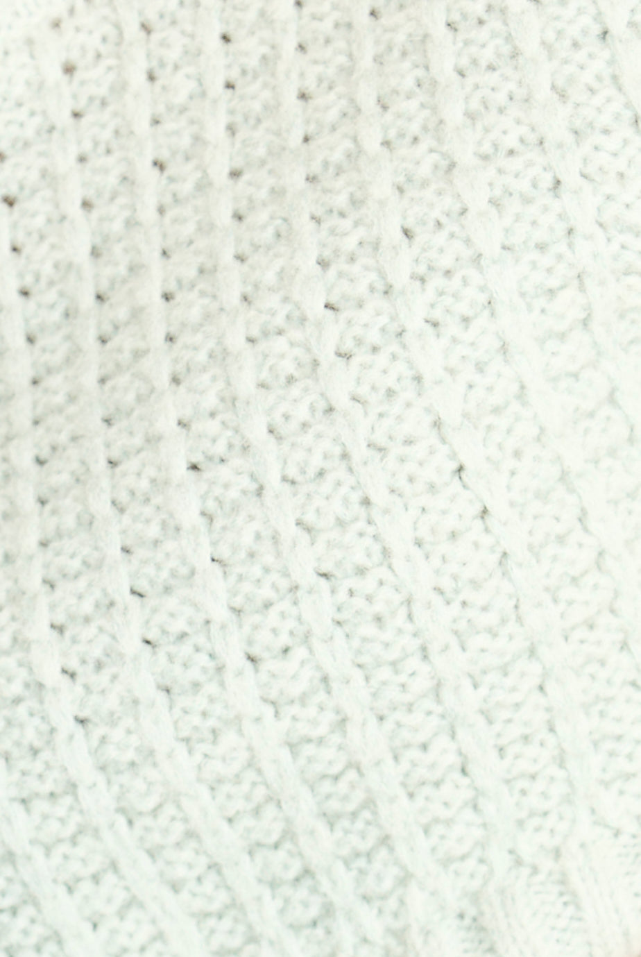 Close-up of a textured white fabric surface