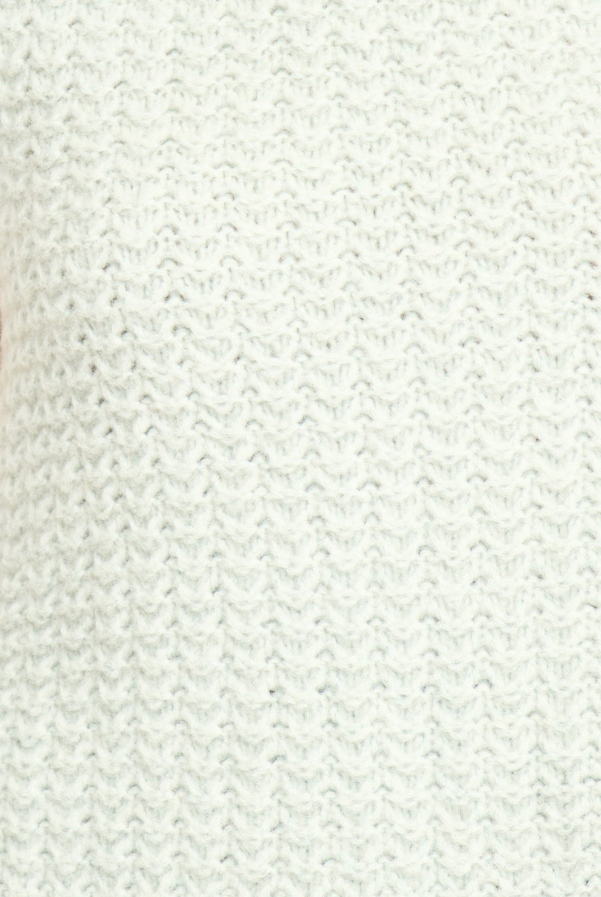 Close-up of a textured white fabric surface
