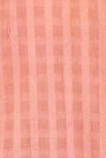 Close-up of a pink textured shirt with buttons