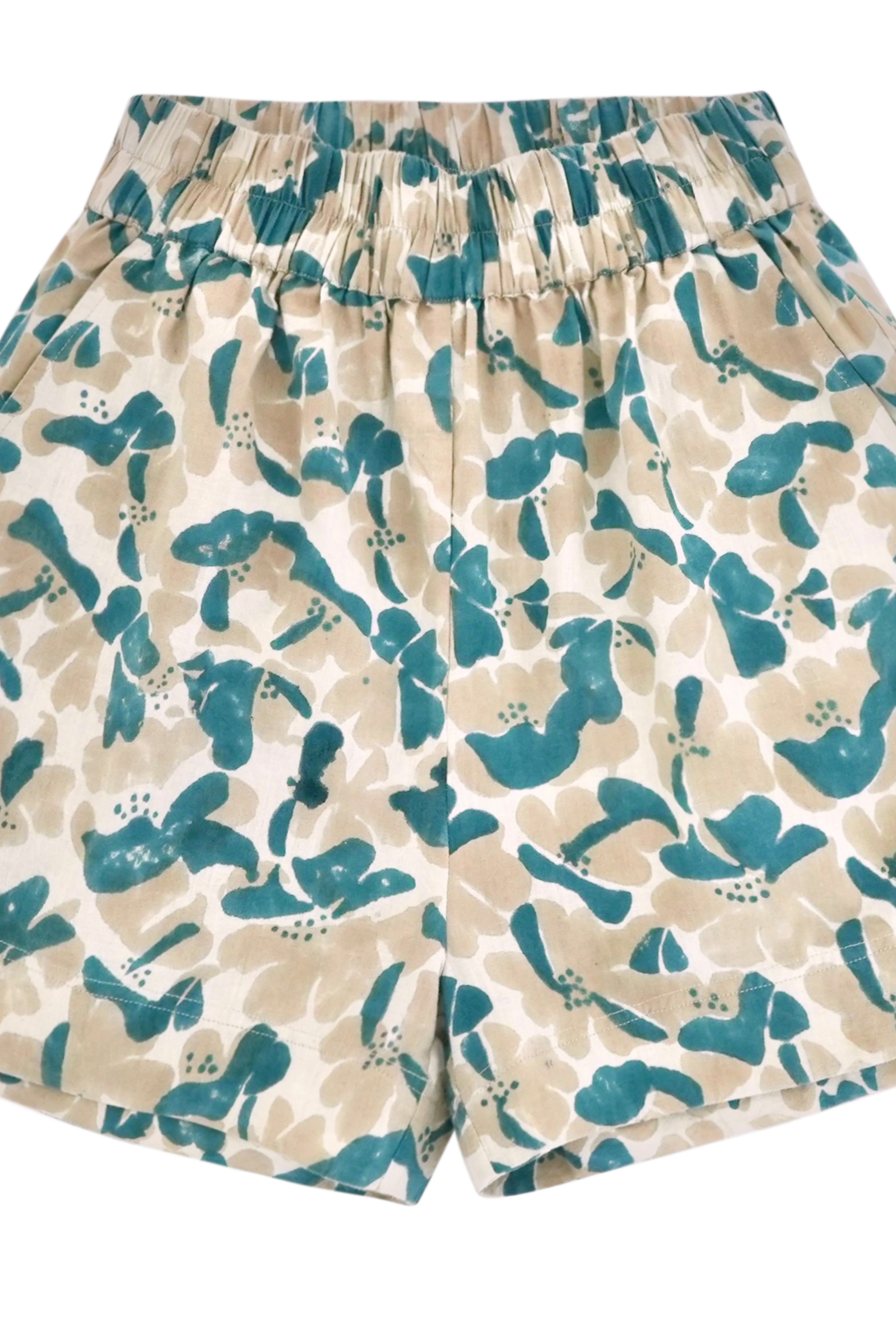 Girl wearing MIRTH women's wide leg elastic track shorts in plumeria blue floral print cotton