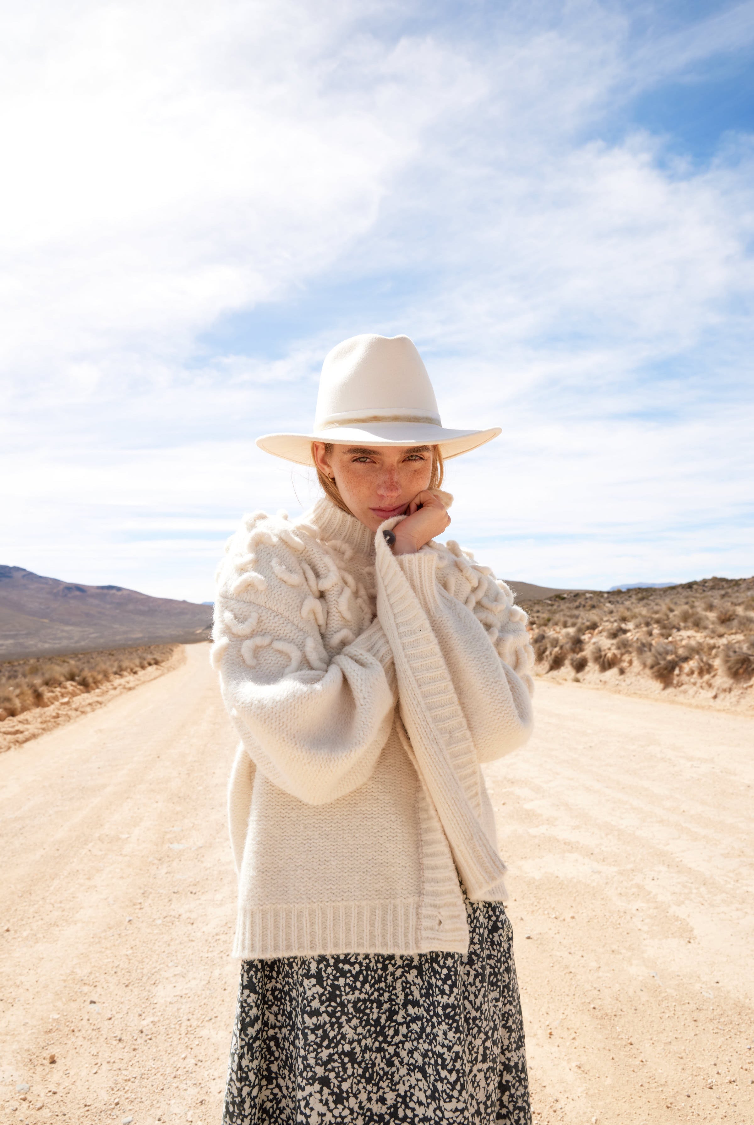 Girl wearing MIRTH women's knit cusco cardigan sweater in ivory white wool