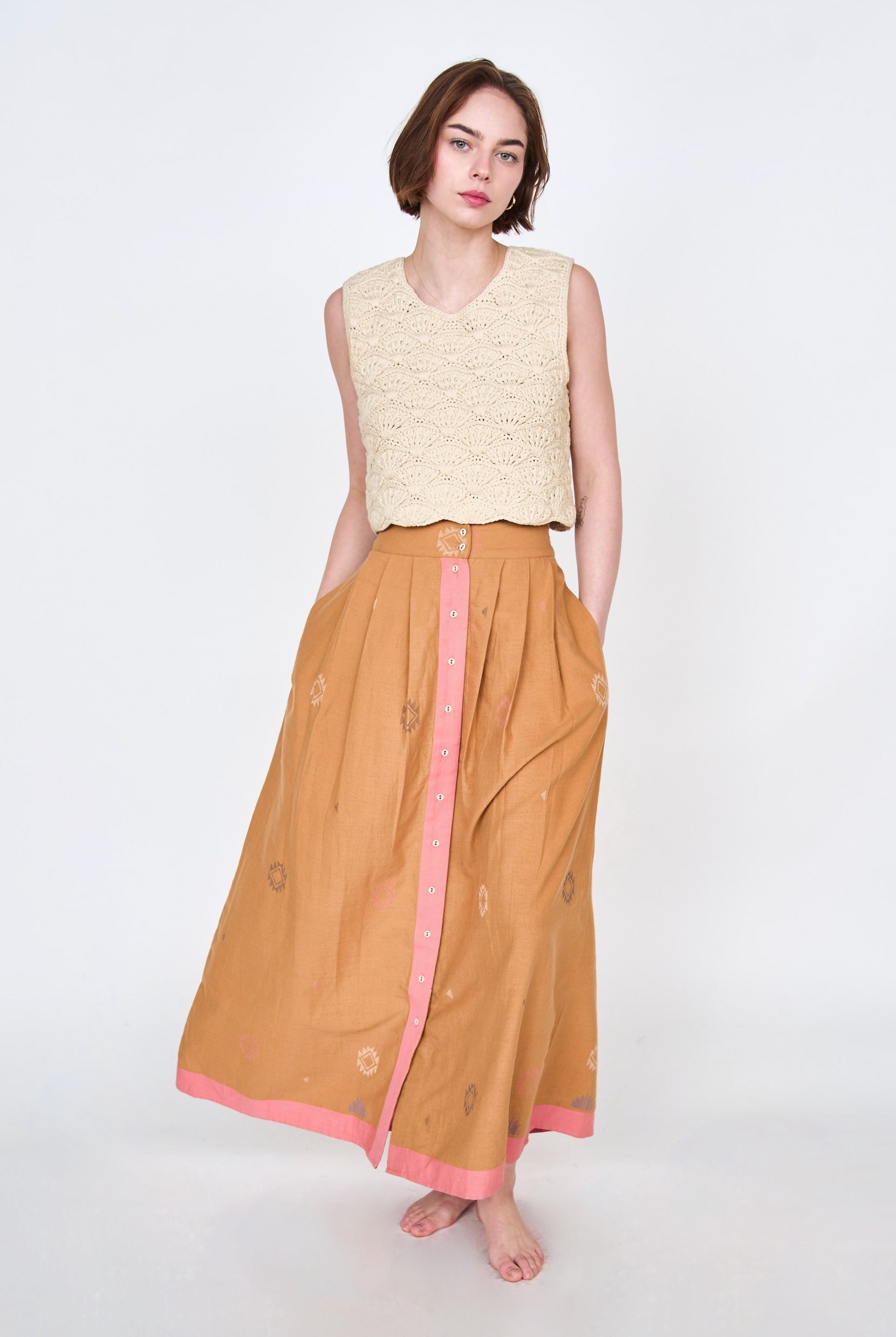 Girl wearing MIRTH women's long lucerne skirt set in handloomed sedona orange jamdani
