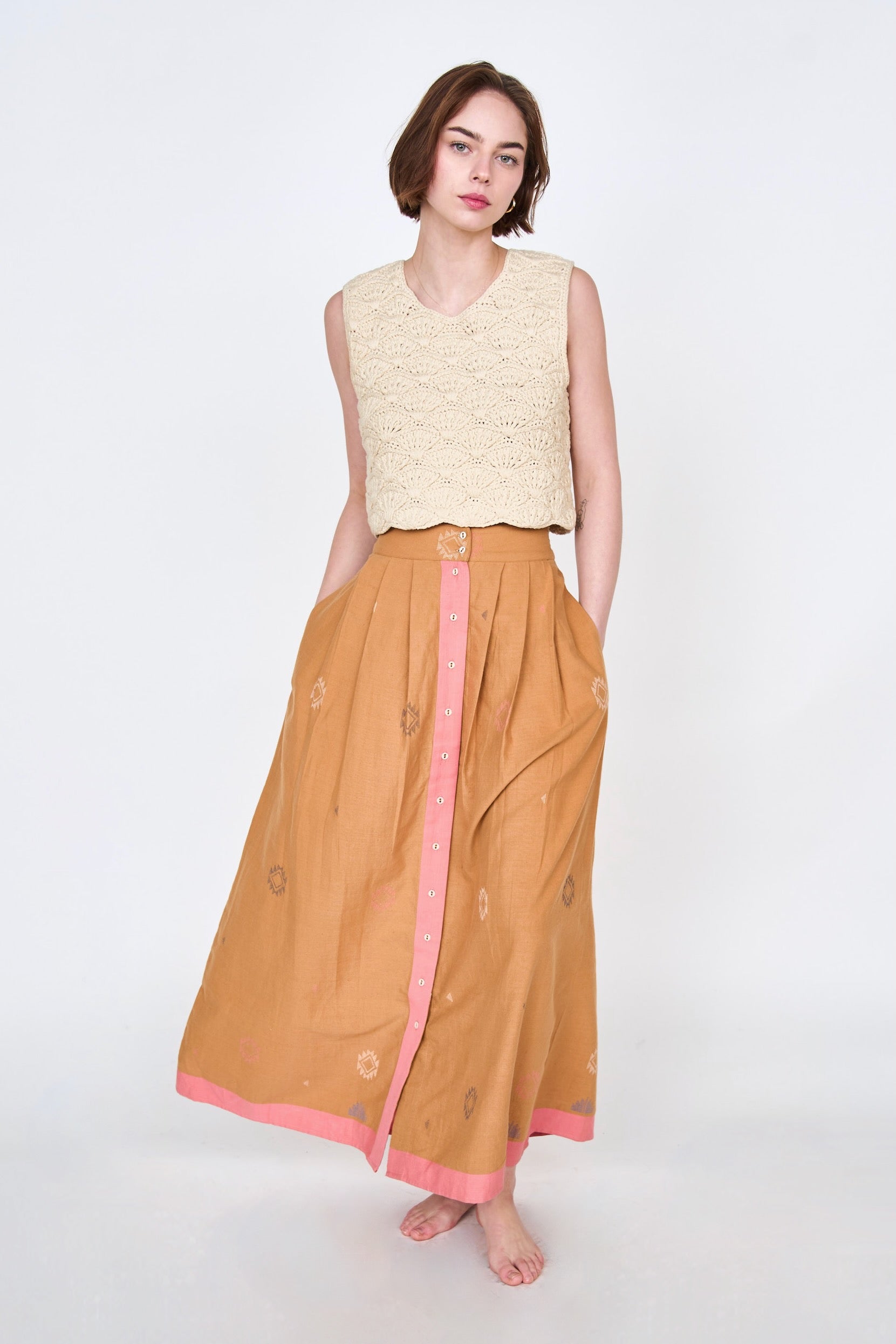 Girl wearing MIRTH women's long lucerne skirt set in handloomed sedona orange jamdani