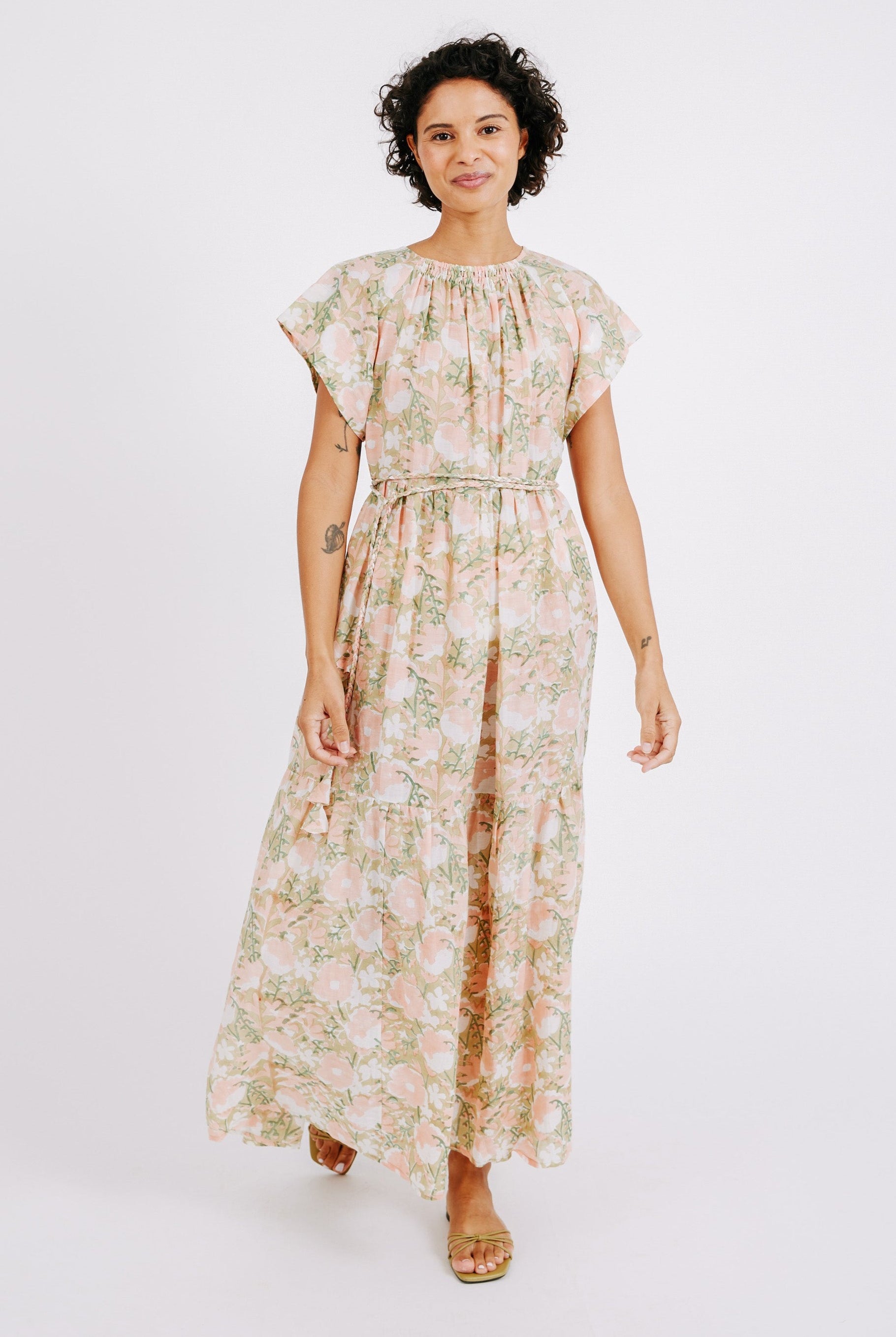 Girl wearing MIRTH women's long tiered short sleeve vienna maxi dress in snapdragon bloom pink floral print cotton