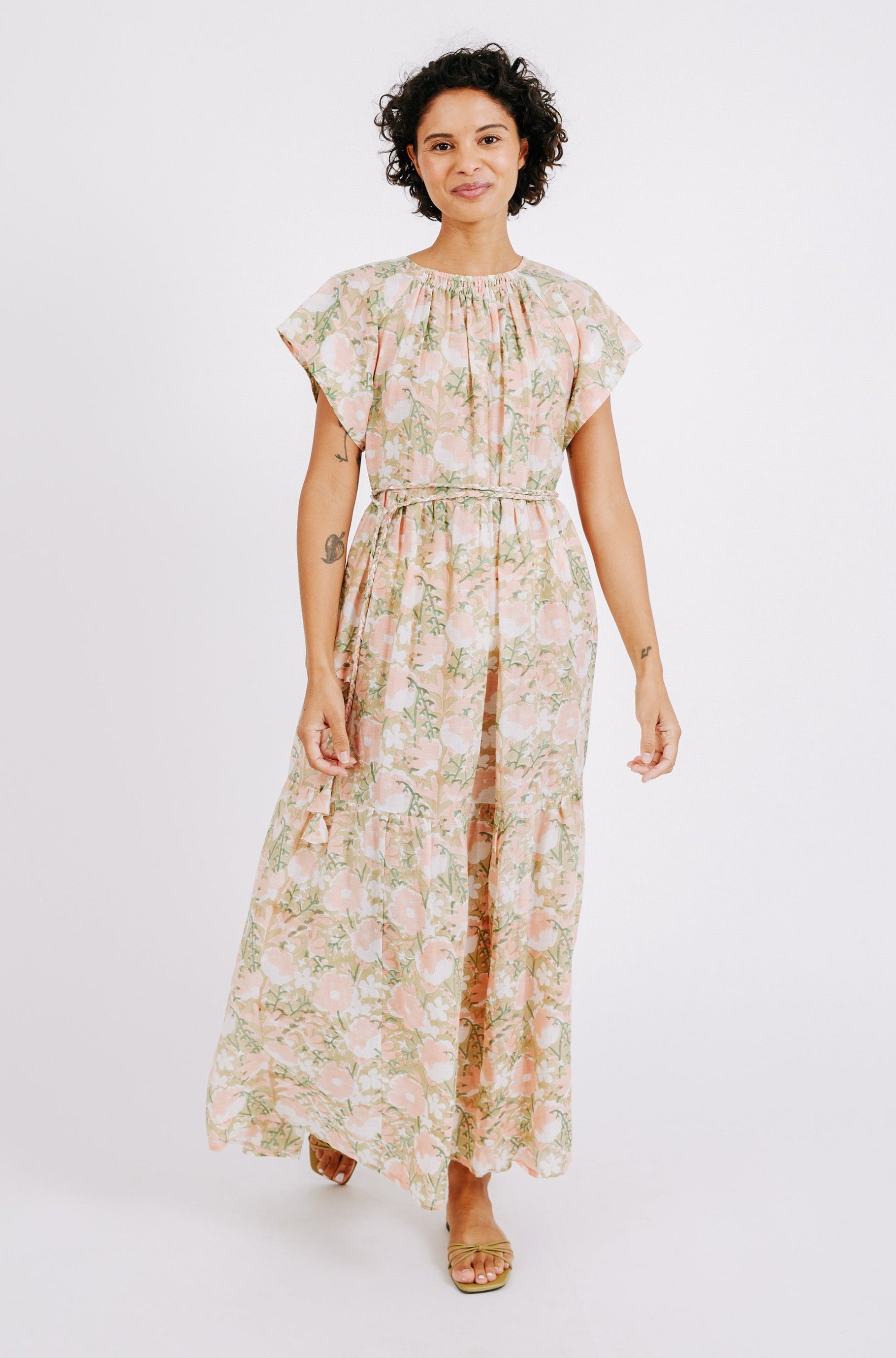 Girl wearing MIRTH women's long tiered short sleeve vienna maxi dress in snapdragon bloom pink floral print cotton