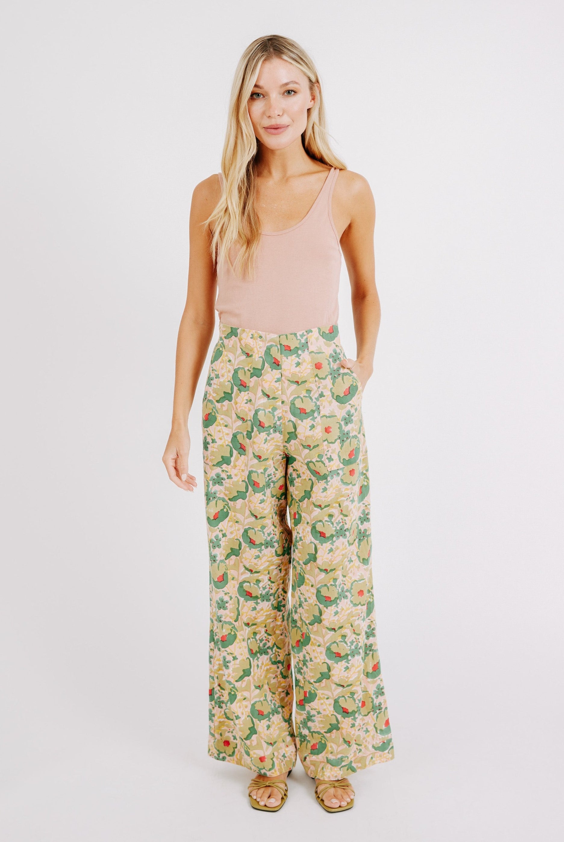 Girl wearing MIRTH women's high waist zip closure cotton tivot pant in rose bloom pink floral print