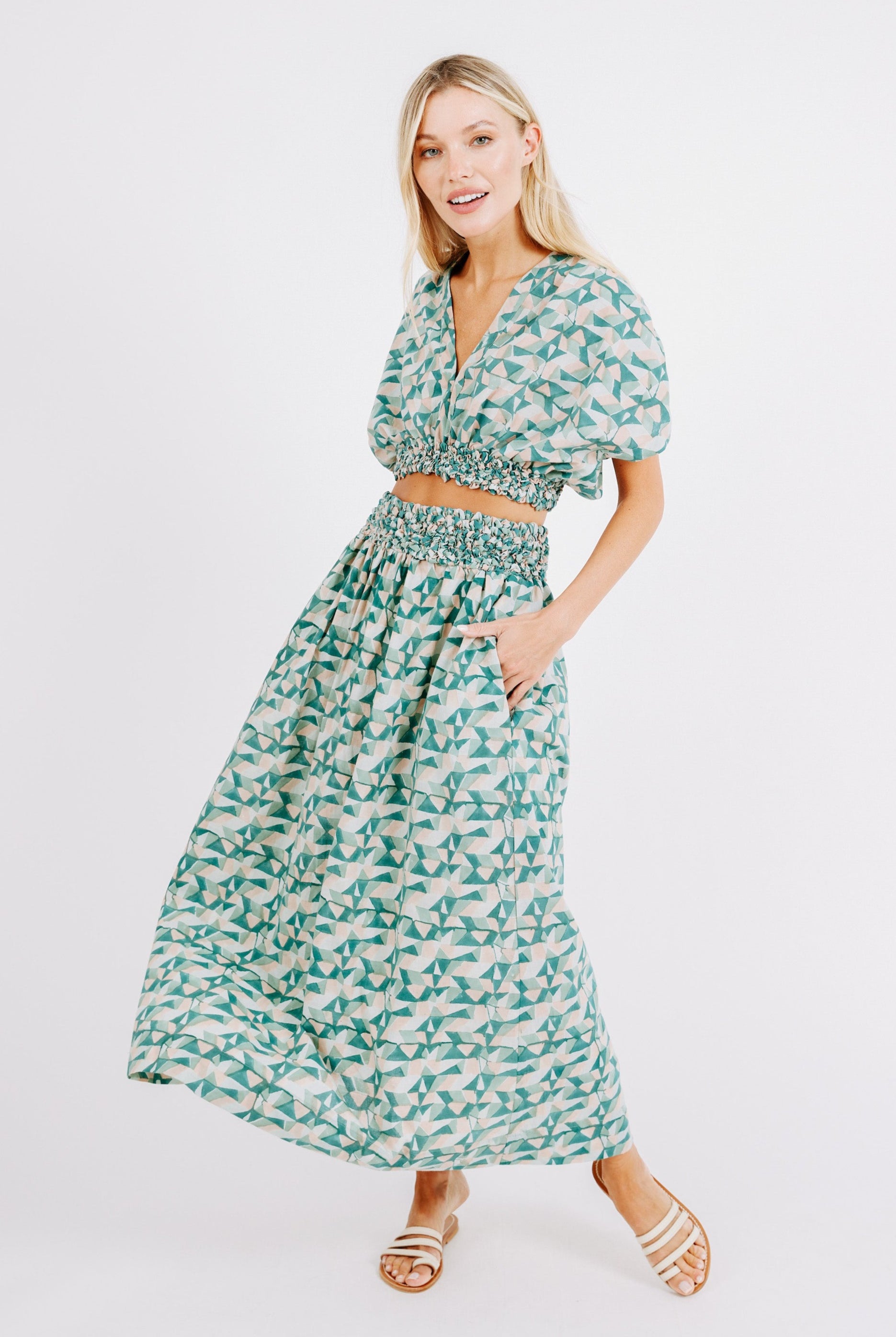 Girl wearing MIRTH women's smocked elastic waist cropped granada top set in seaglass green