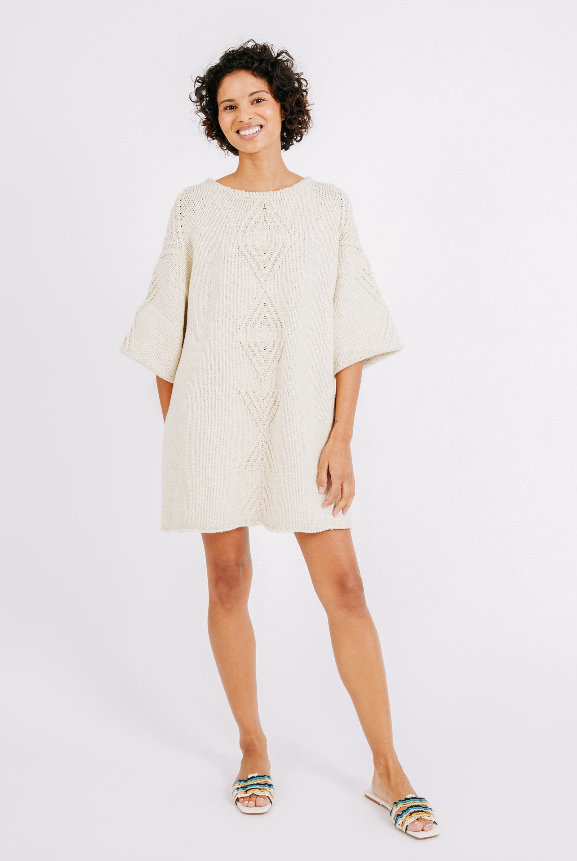 Girl wearing MIRTH women's knit short Osaka sweater dress in bone cream