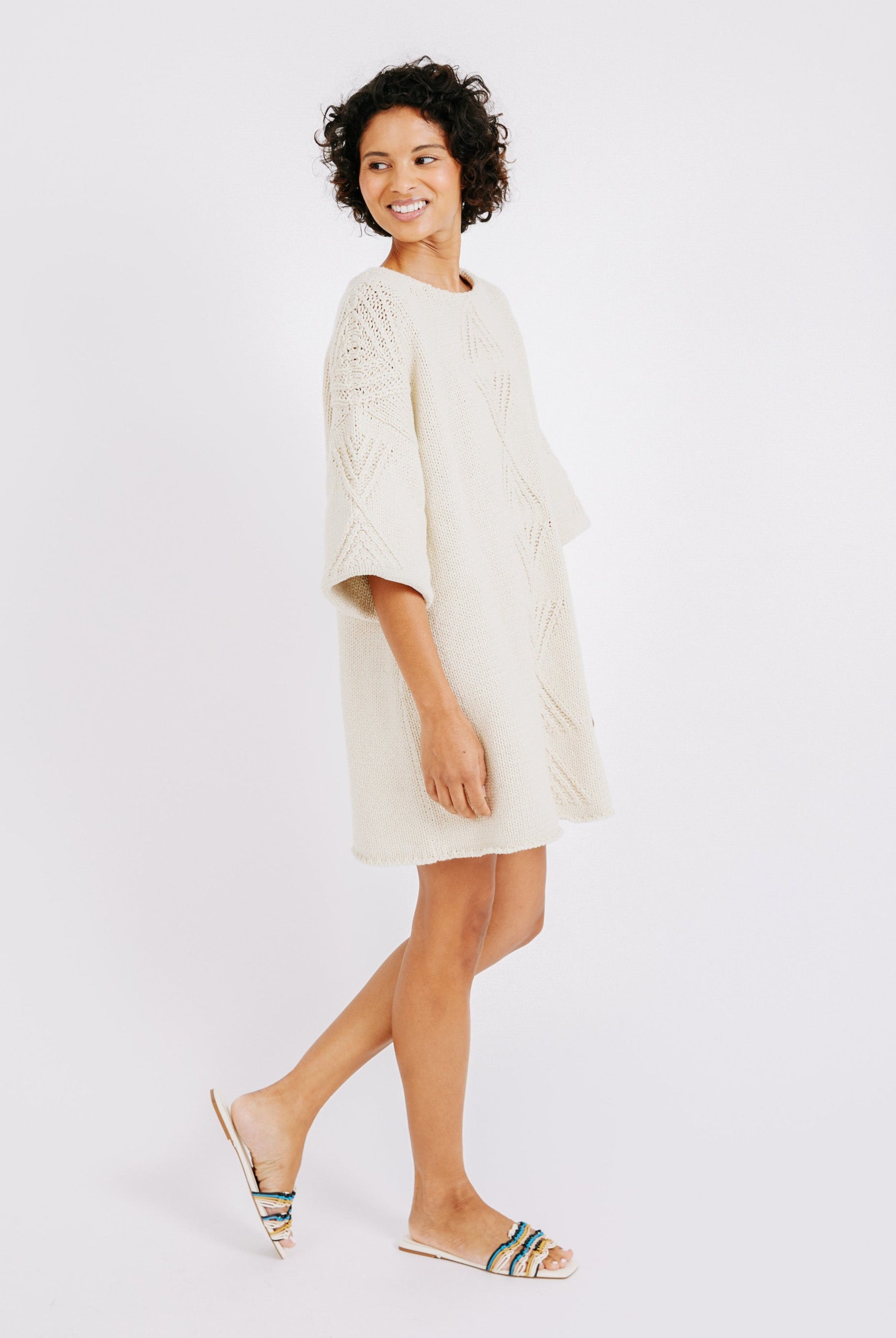 Girl wearing MIRTH women's knit short Osaka sweater dress in bone cream