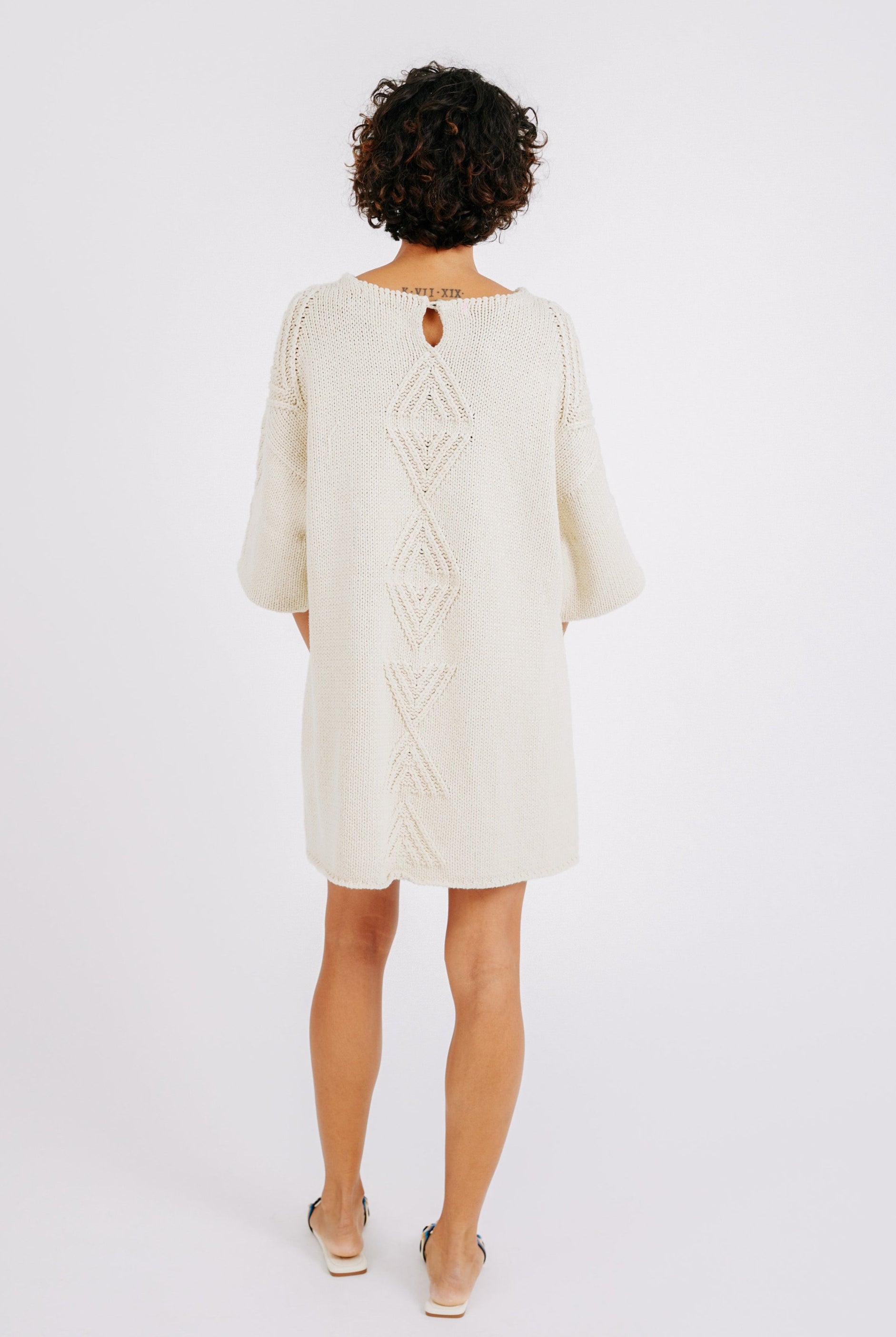 Girl wearing MIRTH women's knit short Osaka sweater dress in bone cream