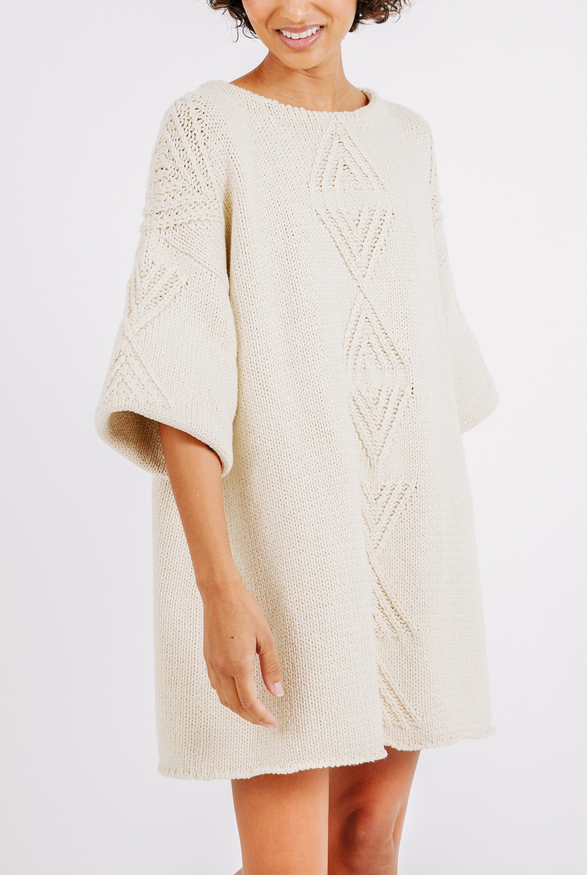 Girl wearing MIRTH women's knit short Osaka sweater dress in bone cream