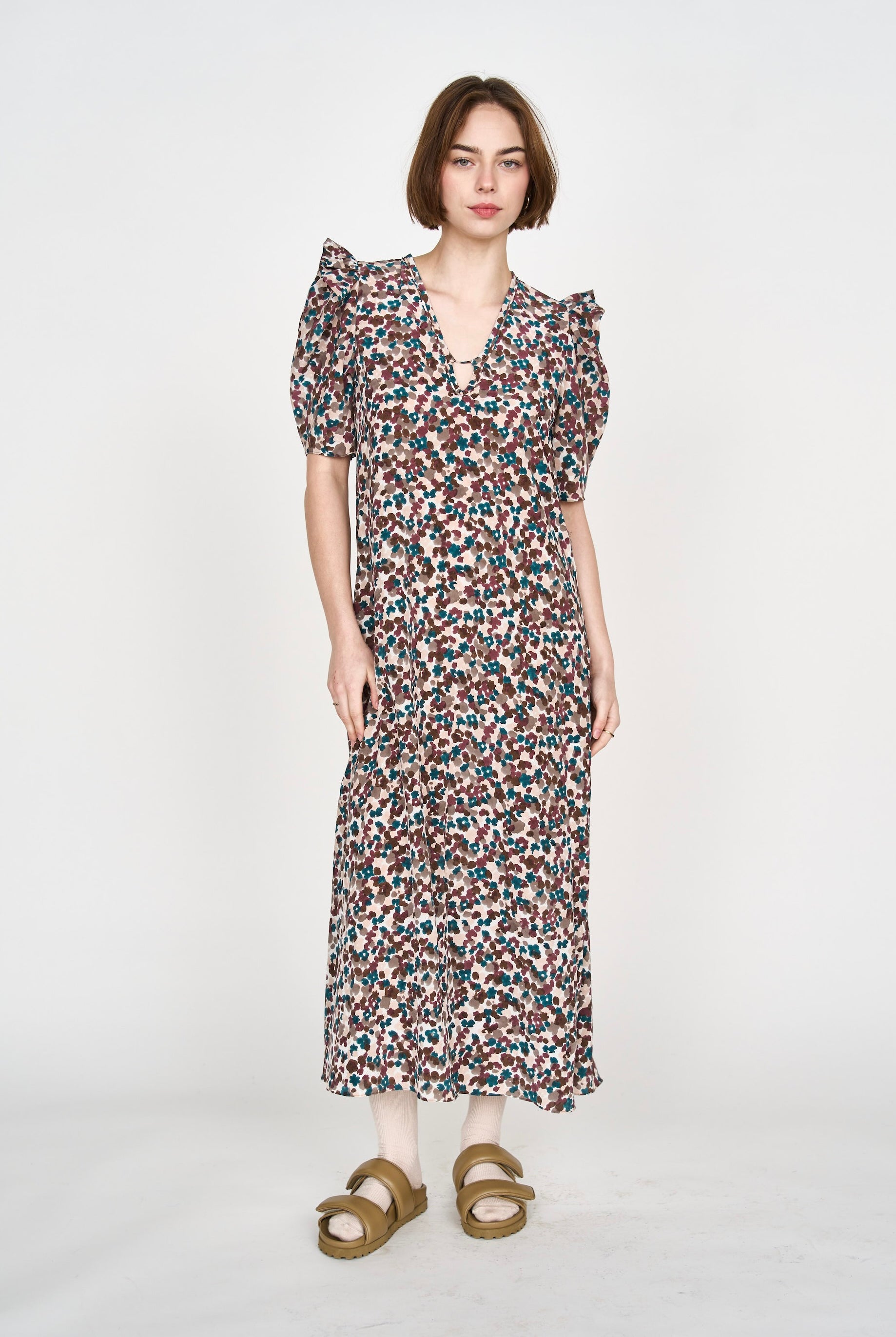 Girl wearing MIRTH women's puff sleeve v neck long cassis dress in purple brown amaryllis silk