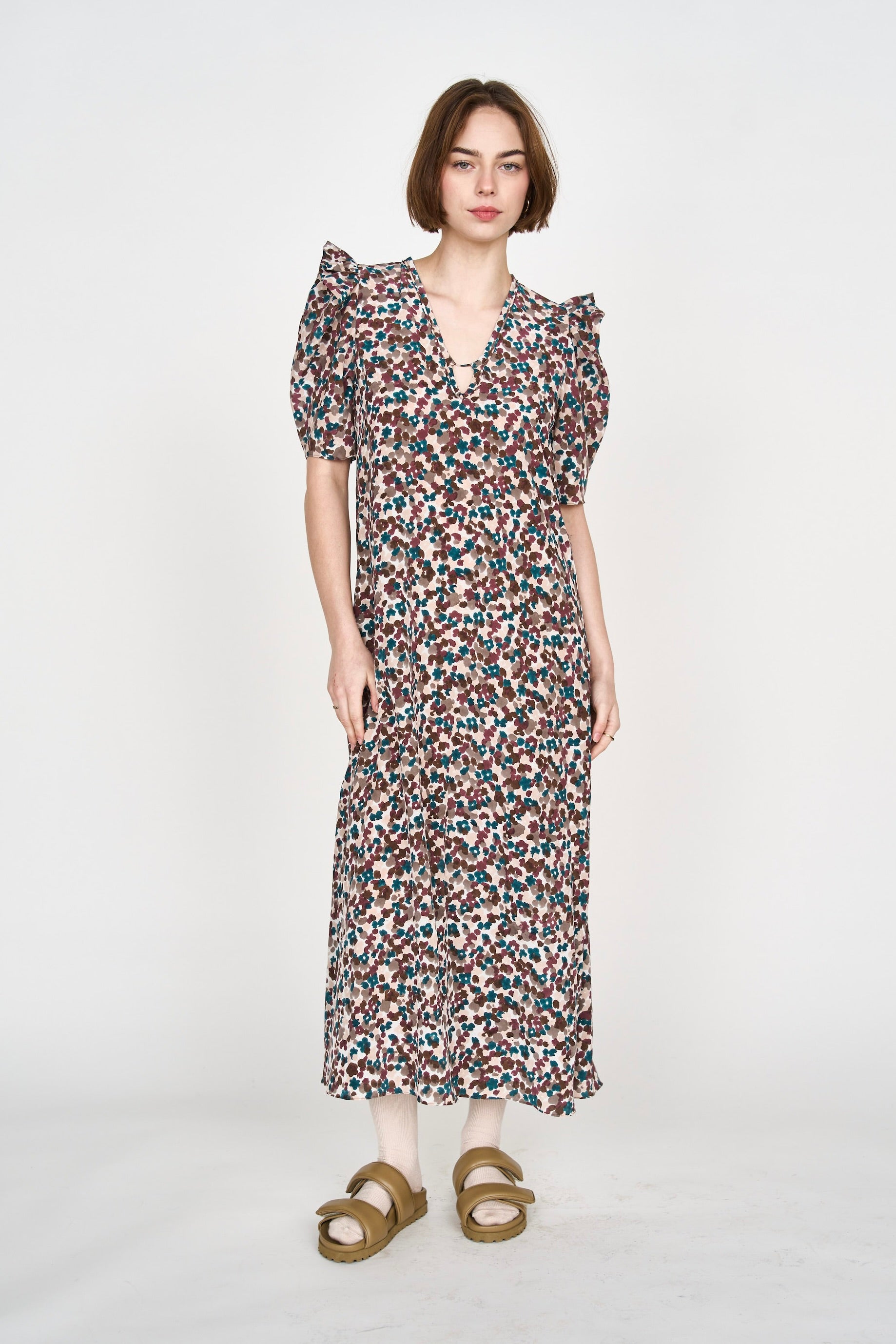 Girl wearing MIRTH women's puff sleeve v neck long cassis dress in purple brown amaryllis silk