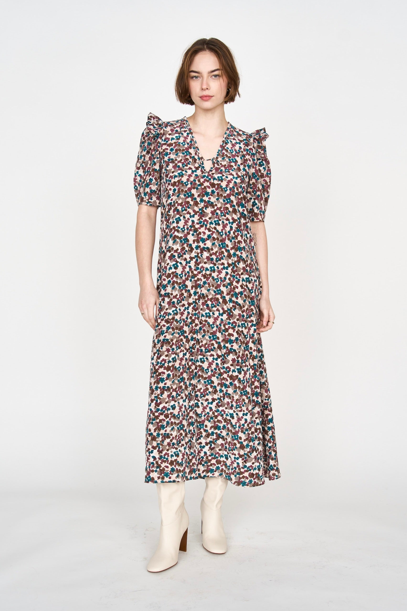 Girl wearing MIRTH women's puff sleeve v neck long cassis dress in purple brown amaryllis silk