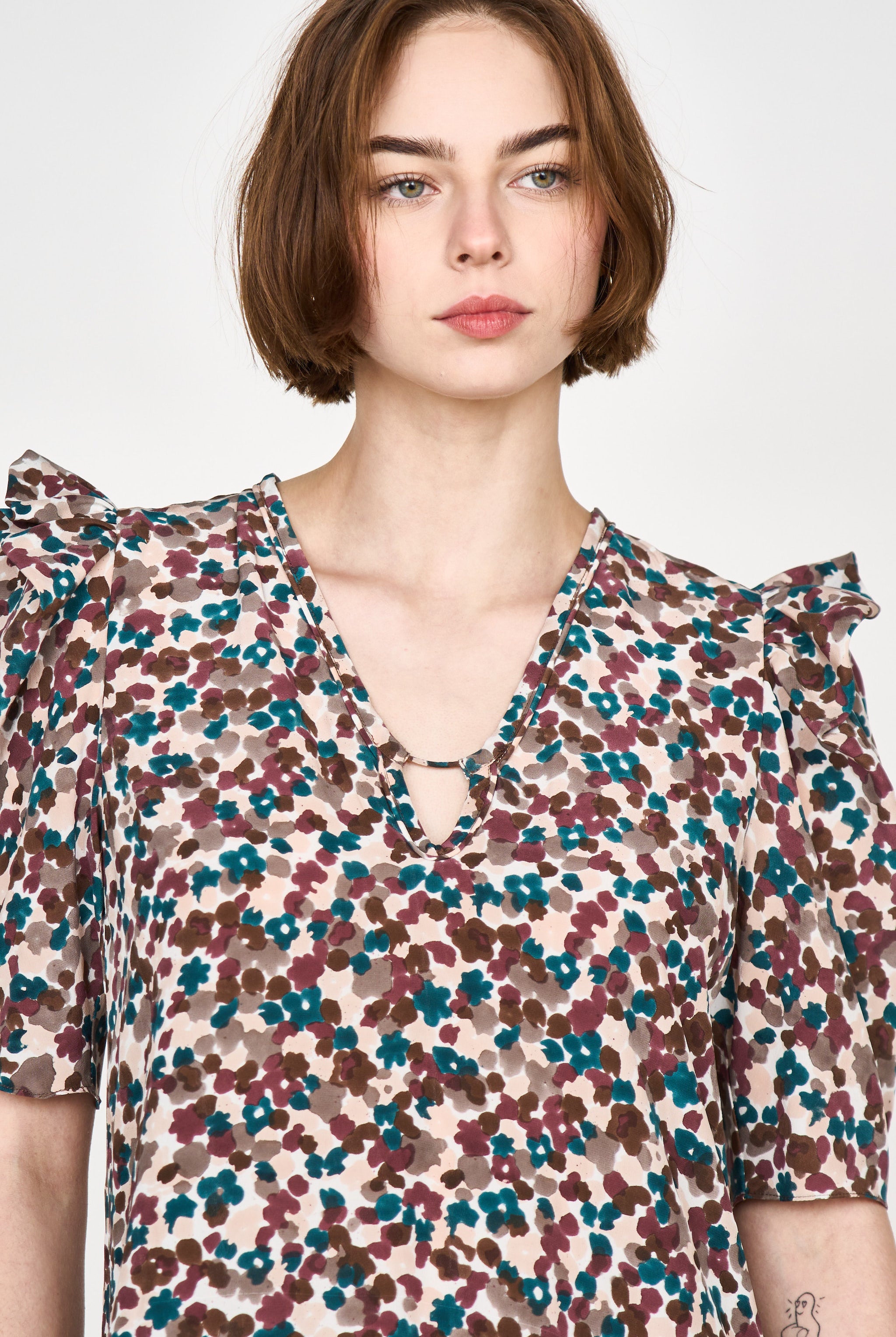 Girl wearing MIRTH women's puff sleeve v neck long cassis dress in purple brown amaryllis silk