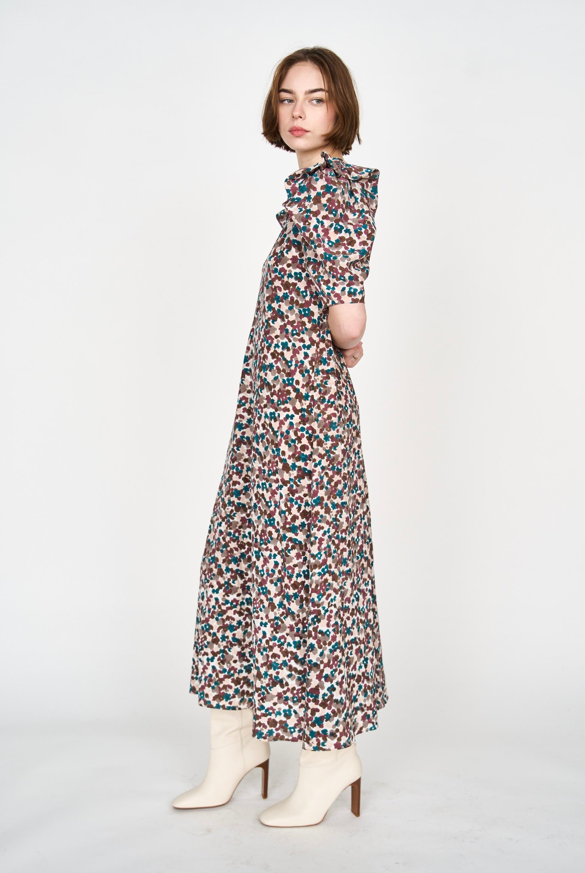 Girl wearing MIRTH women's puff sleeve v neck long cassis dress in purple brown amaryllis silk