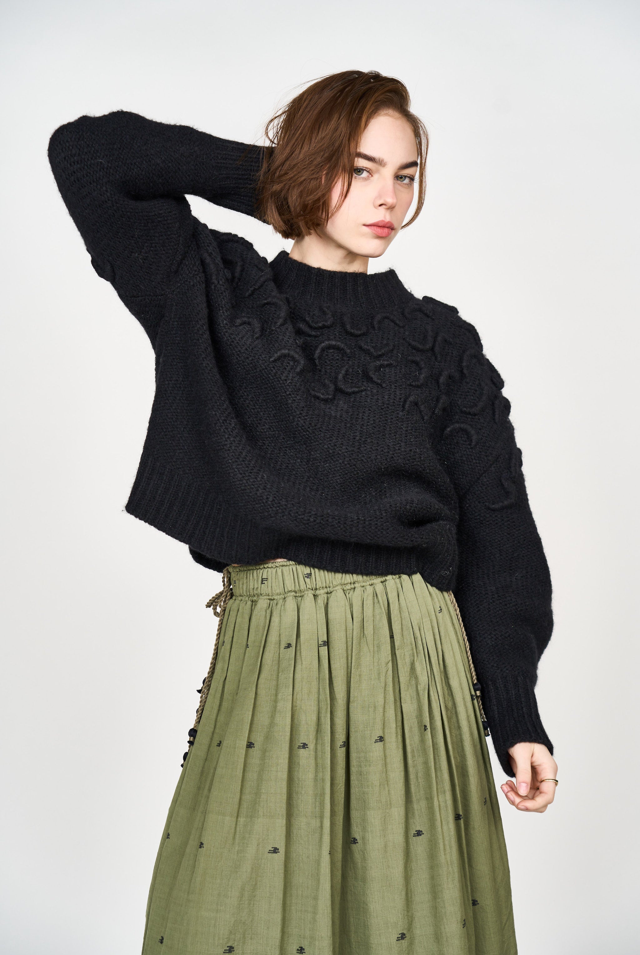 Girl wearing MIRTH women's knit cusco pullover sweater in black wool