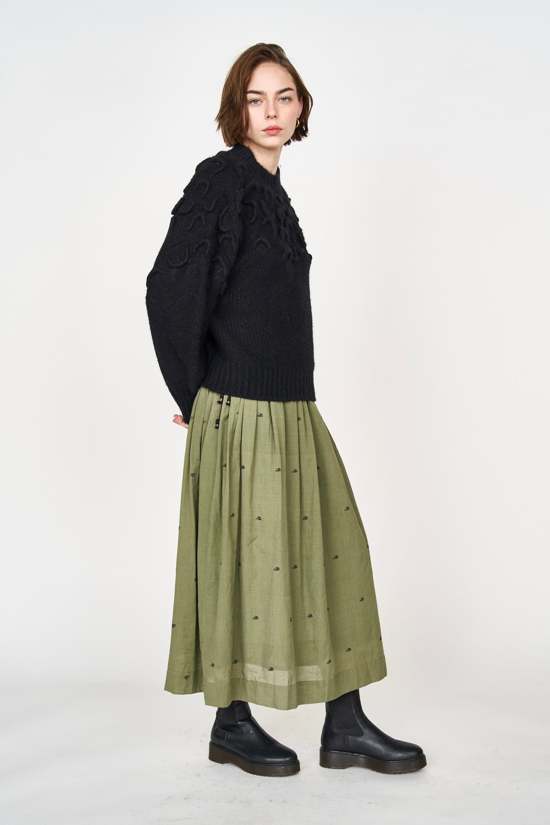 Girl wearing MIRTH women's knit cusco pullover sweater in black wool