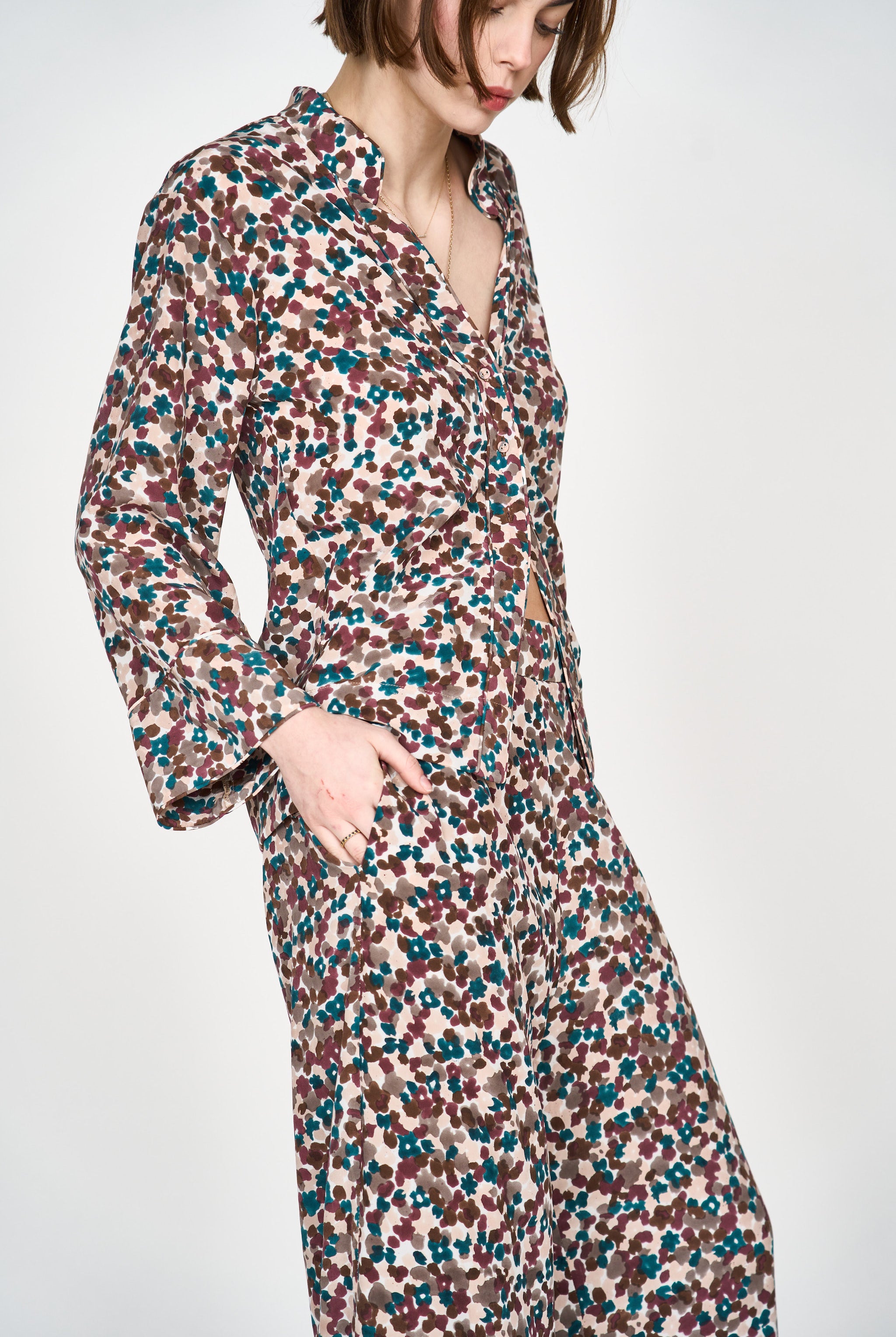 Girl wearing MIRTH women's button down collared long sleeve malmo shirt in purple brown amaryllis silk