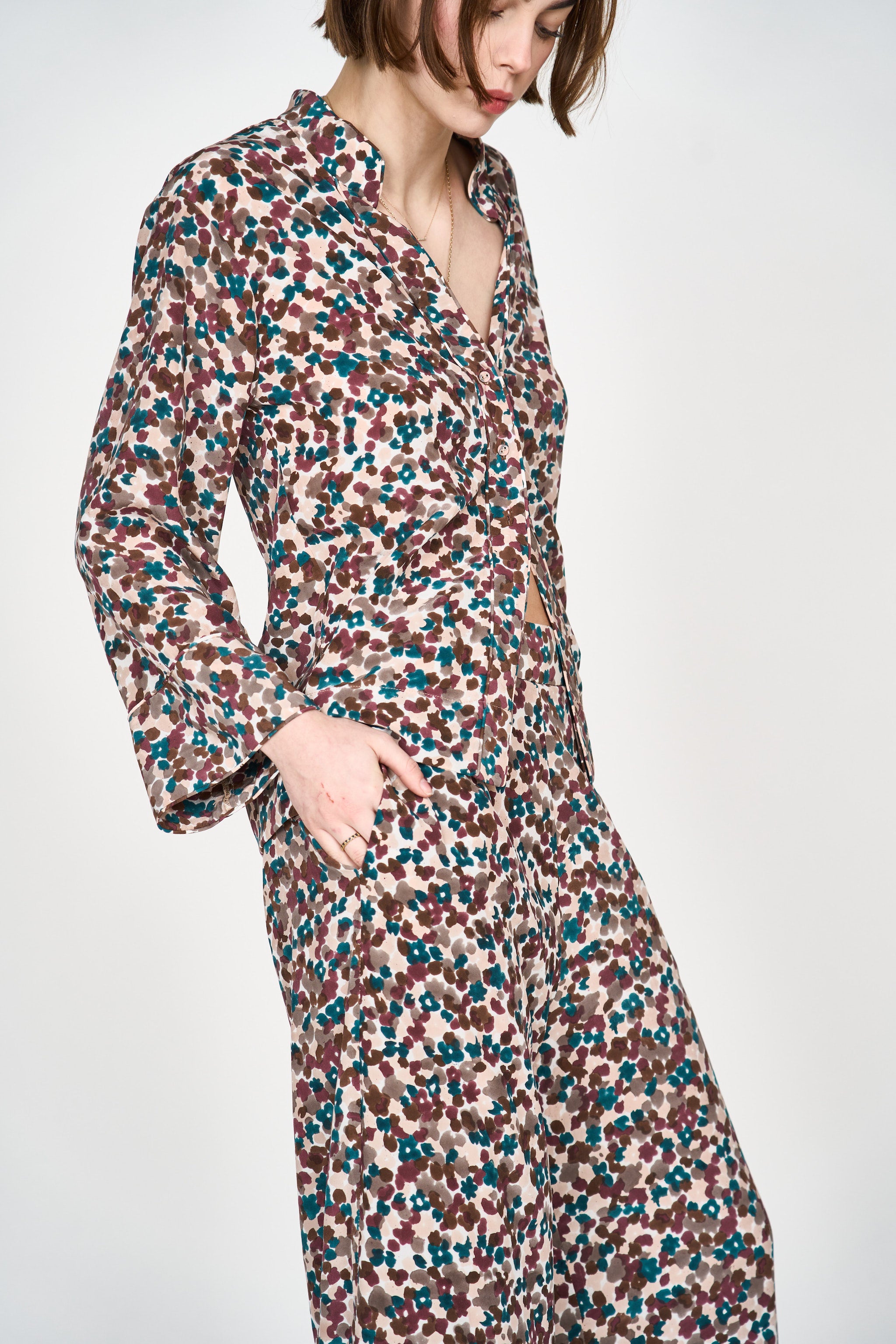 Girl wearing MIRTH women's button down collared long sleeve malmo shirt in purple brown amaryllis silk