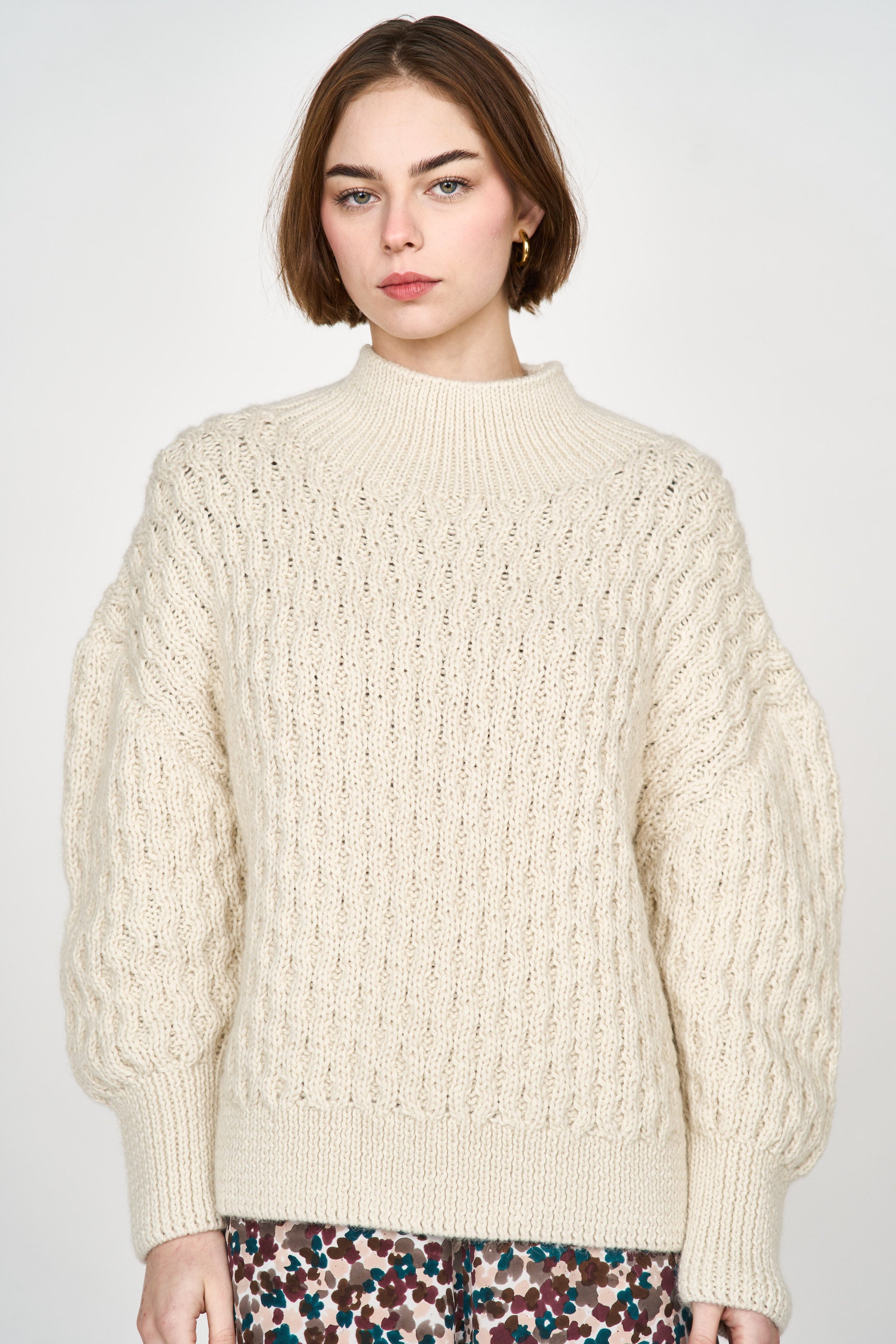 Girl wearing MIRTH women's pullover hand knit honeycomb weave megeve turtleneck sweater in ivory alpaca wool