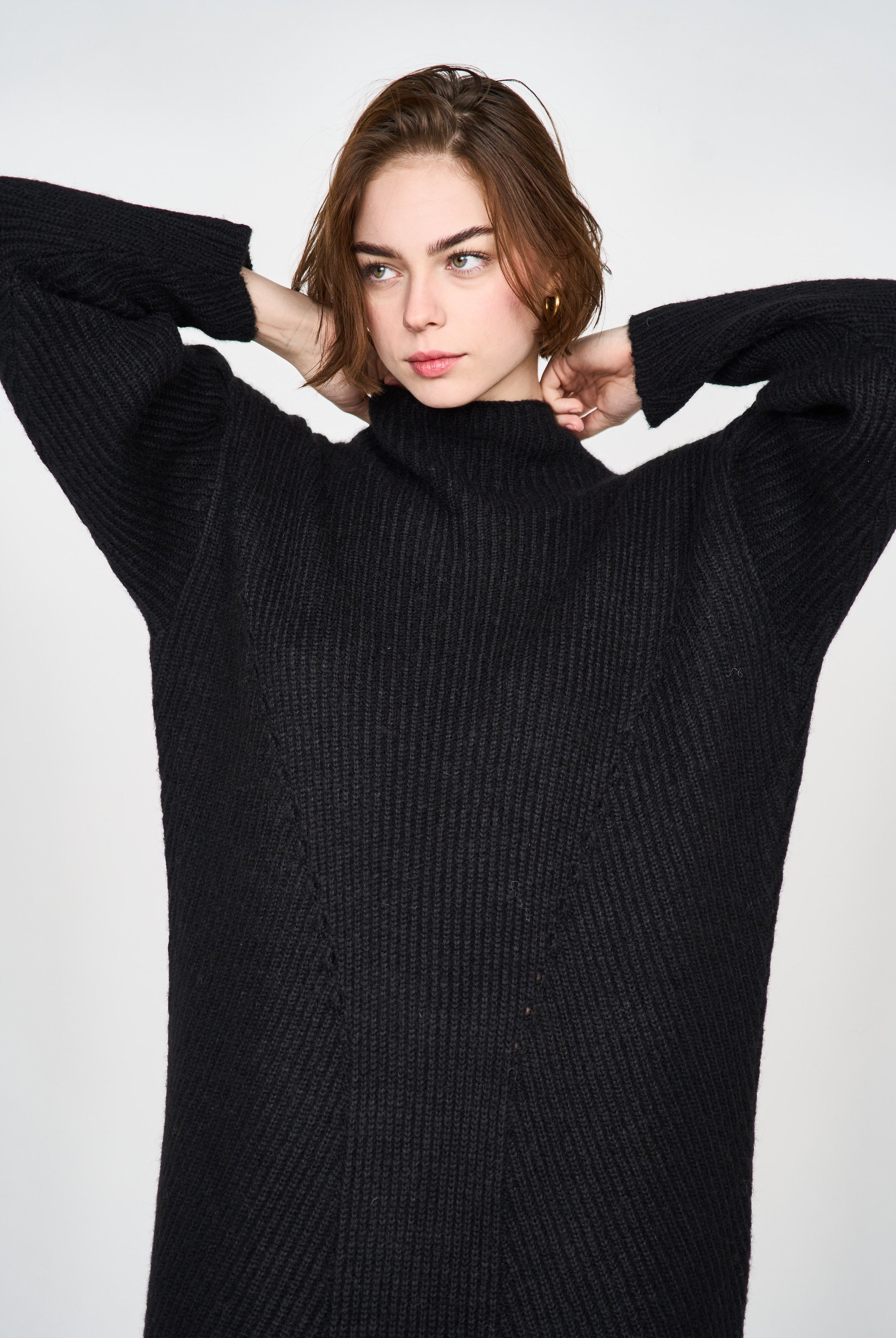 Girl wearing MIRTH women's knit pichu pichu sweater dress in black wool