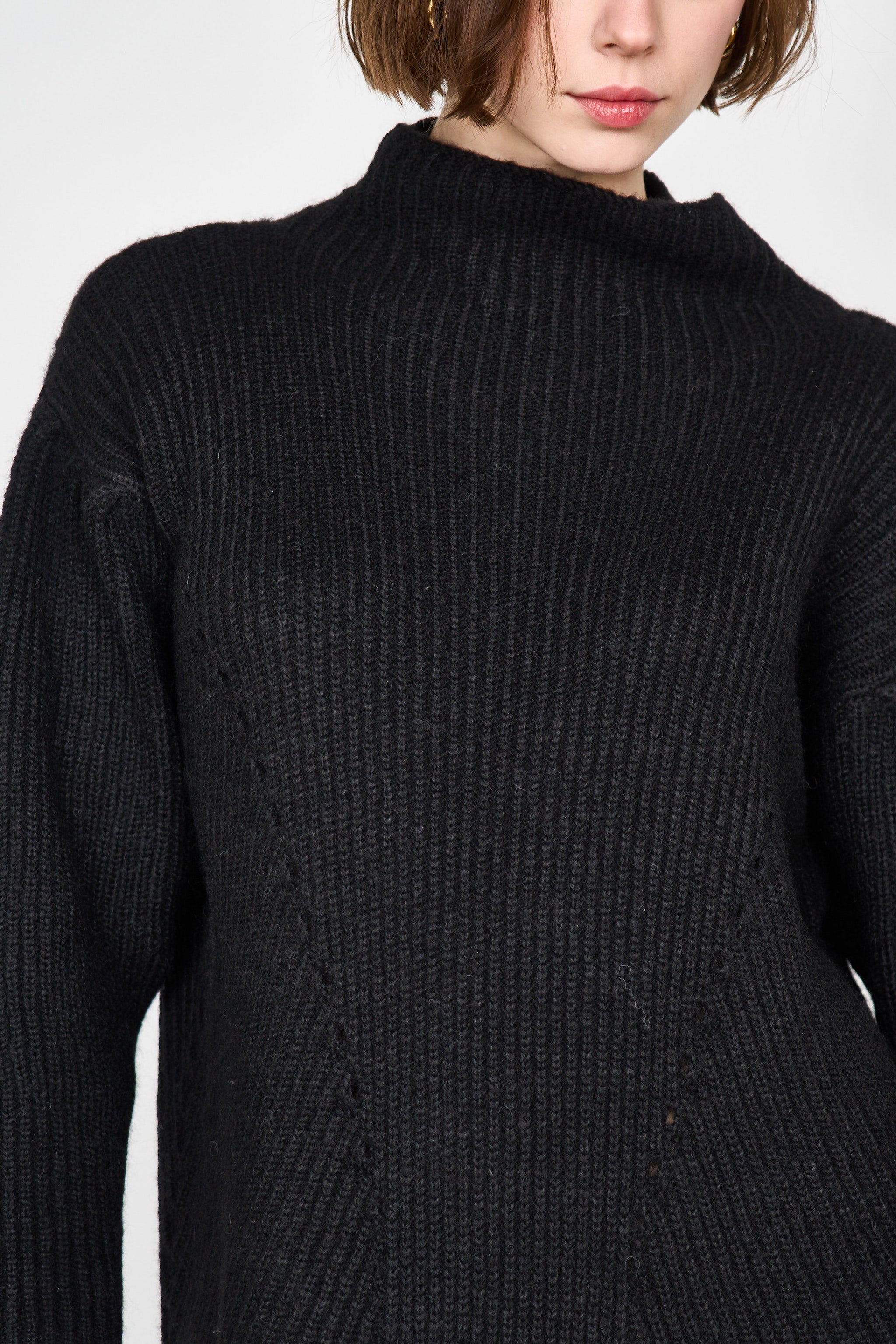 Girl wearing MIRTH women's knit pichu pichu sweater dress in black wool