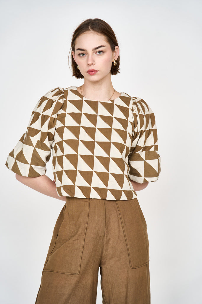 Girl wearing MIRTH women's puff sleeve pullover santanyi top in brown tannin ecru patchwork cotton
